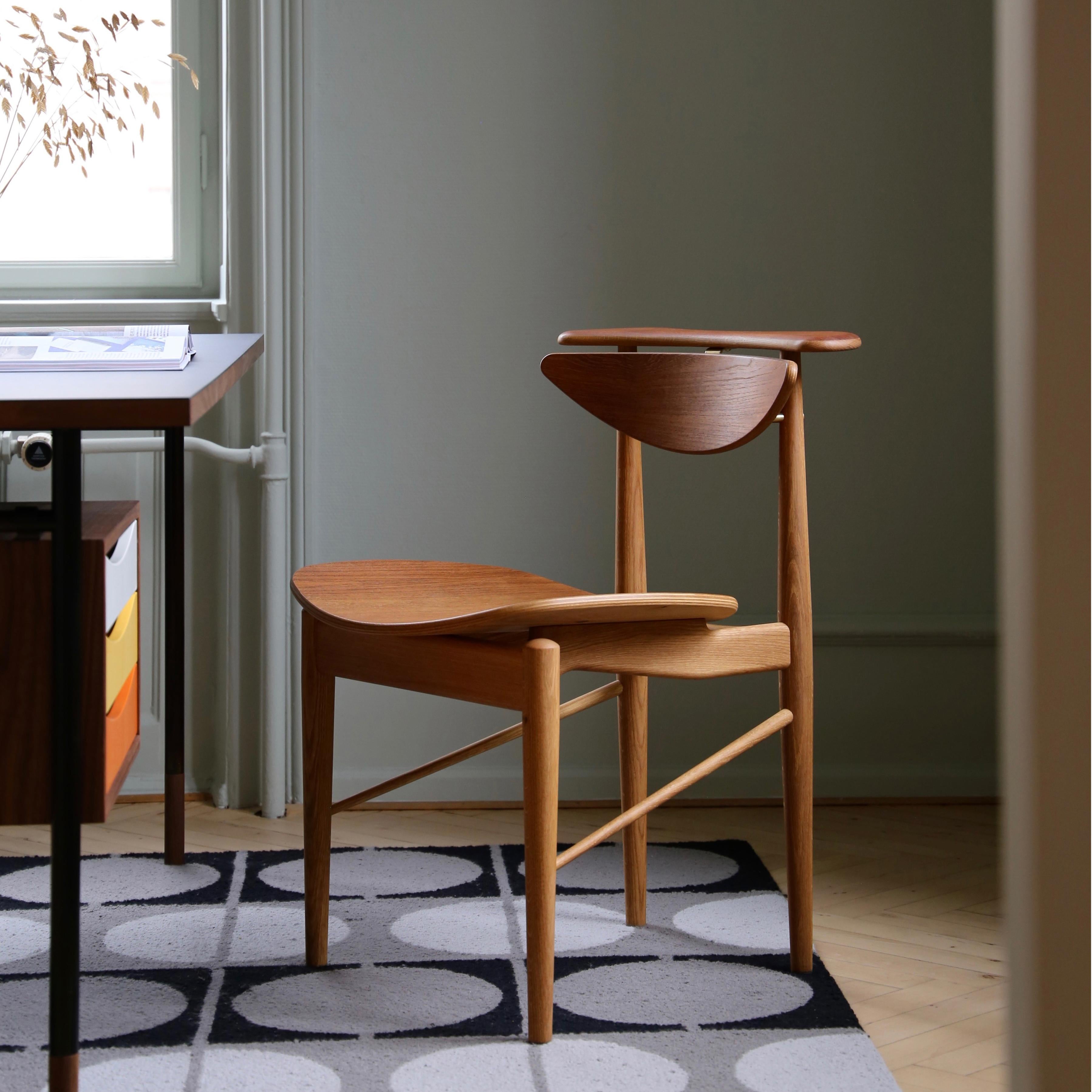 Chair designed by Finn Juhl in 1953, relaunched in 2015.
Manufactured by House of Finn Juhl in Denmark.

The Reading chair is one of Finn Juhl's more simple, yet elegant, pieces. The chair is characterized by intricate details and a quirky story.