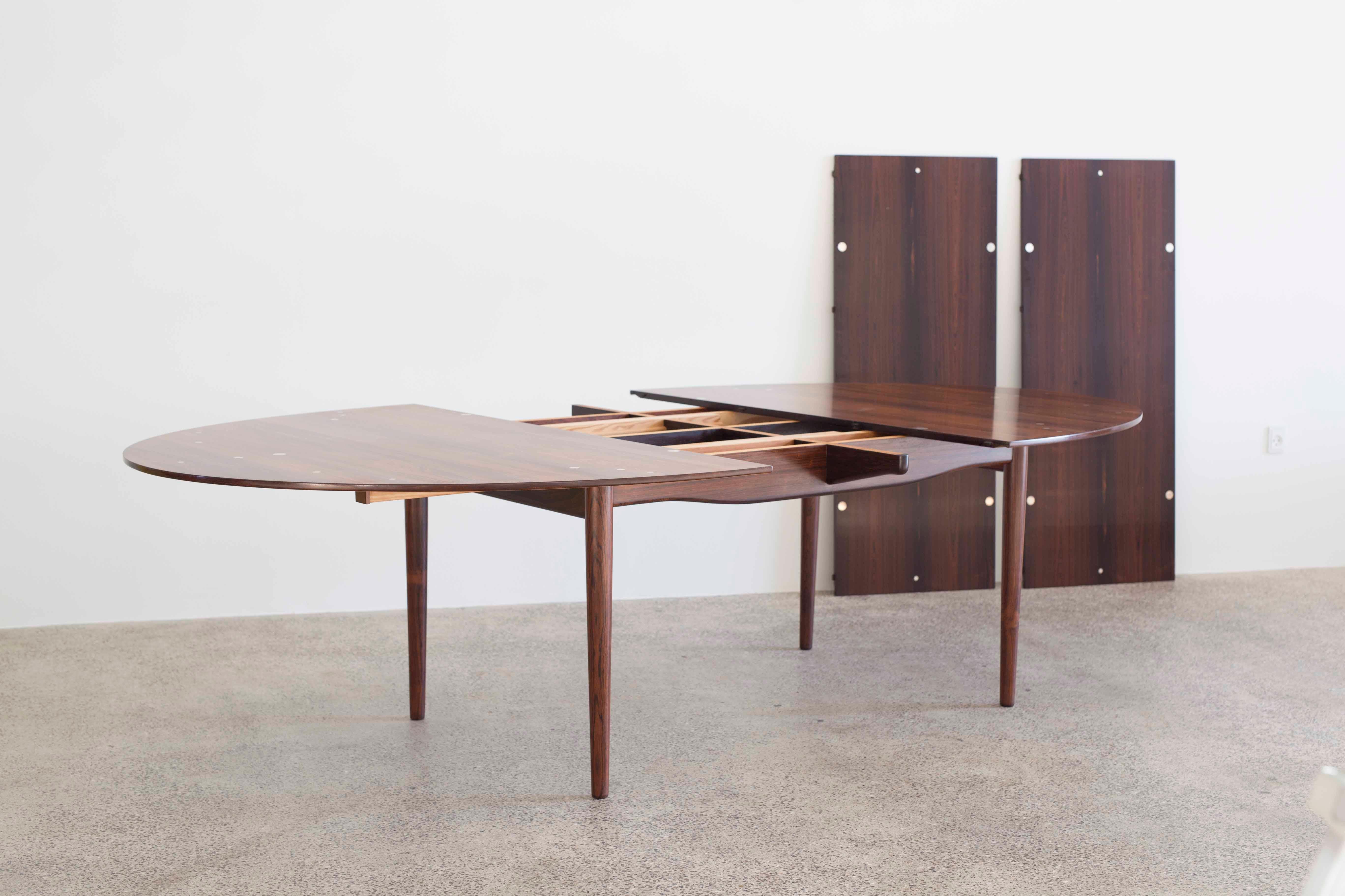 Finn Juhl Judas table in Brazilian rosewood with 30 sterling silver inlays in the main table. Including two extension leaves.
Designed 1948 and manufactured by cabinetmaker Niels Vodder, Denmark.
Measures: W 200/310 x D 140cm x H 72.5 cm.

 