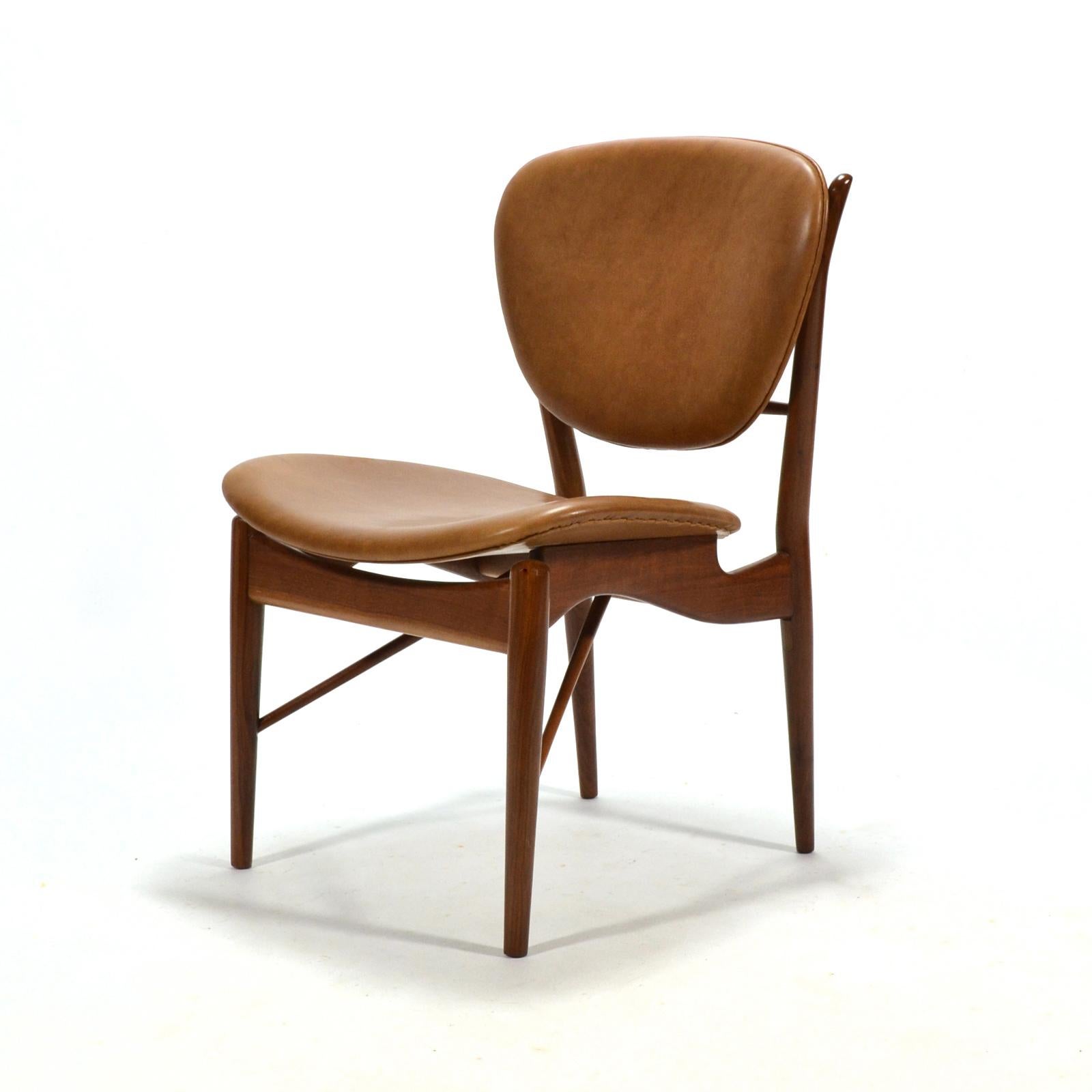 Finn Juhl's elegant, sculptural, and remarkably comfortable side chair by Baker is perfect for use at a dining table, writing table, desk or vanity.