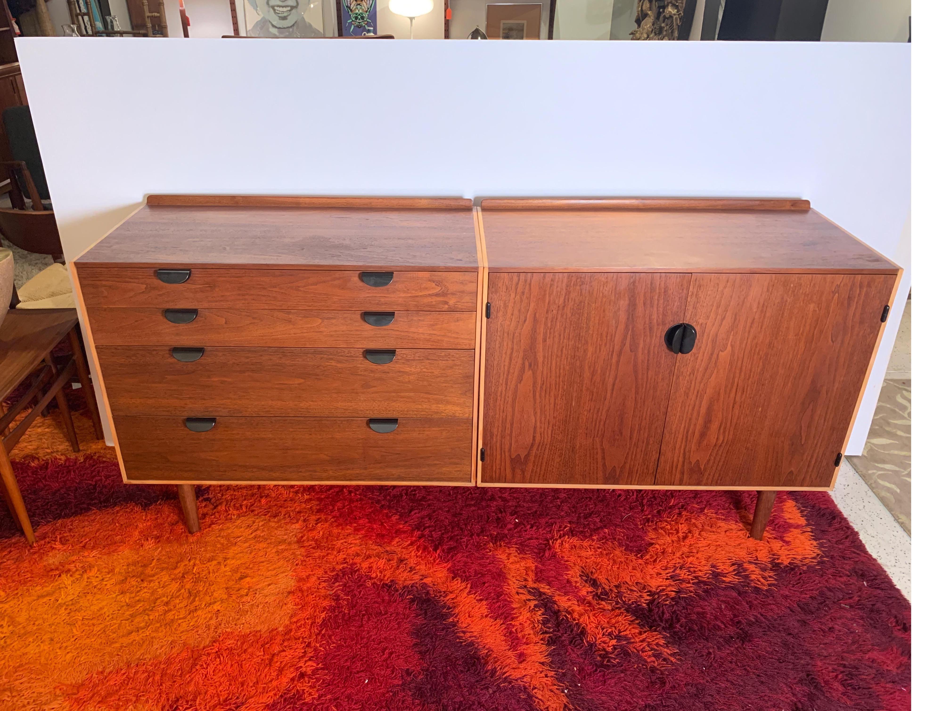 Beautiful and dignified sideboard in maple and teak, designed by Finn Juhl for Baker Furniture Company. Two cabinets, one with four drawers and one with two doors, sit upon a wooden base with tapered legs. Finn Juhl was skeptical that an American