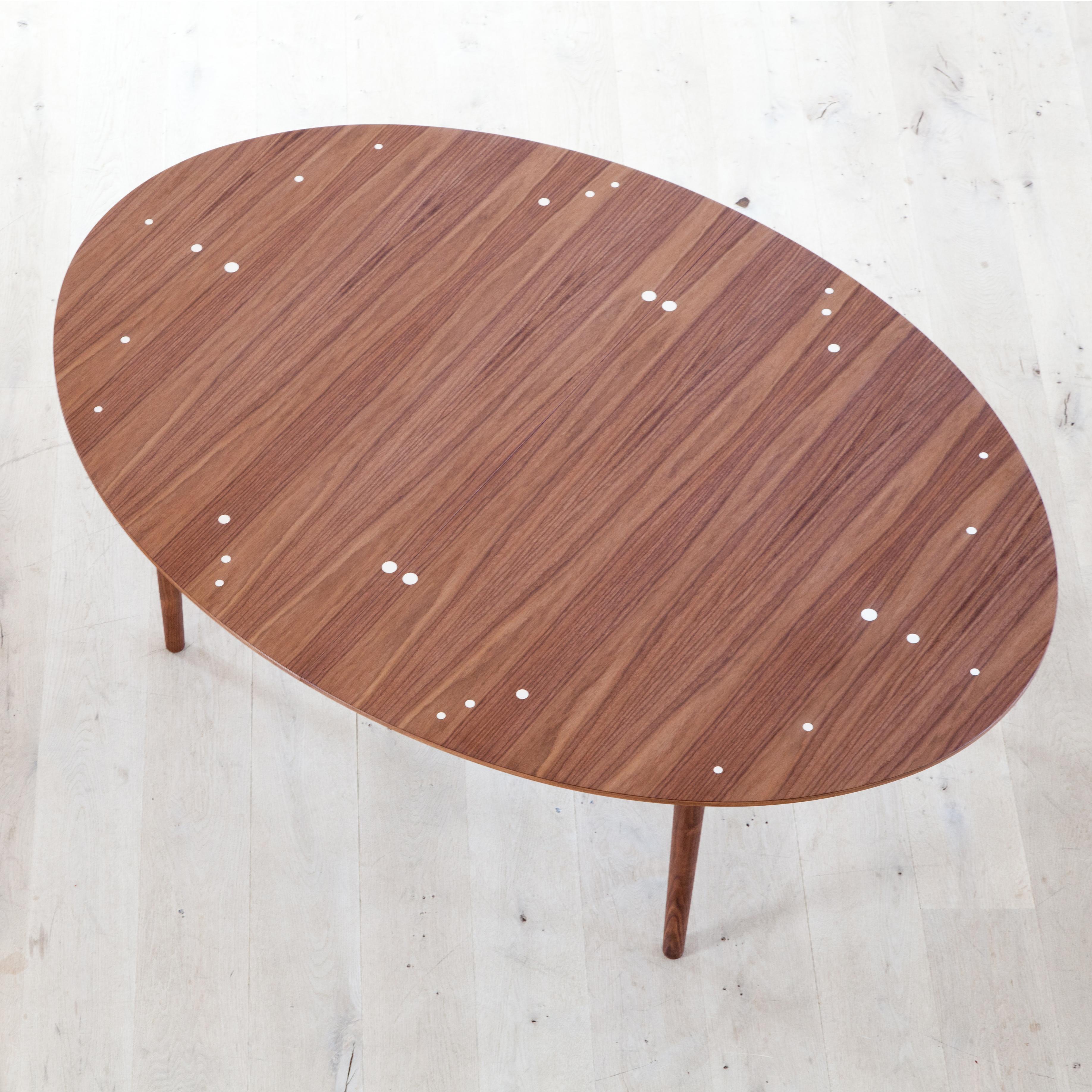Table designed by Finn Juhl in 1948, relaunched in 2014.
Manufactured by House of Finn Juhl in Denmark.

This oval dining or conference table can be extended with two extra leaves, while the frame stays in the same position. The table was