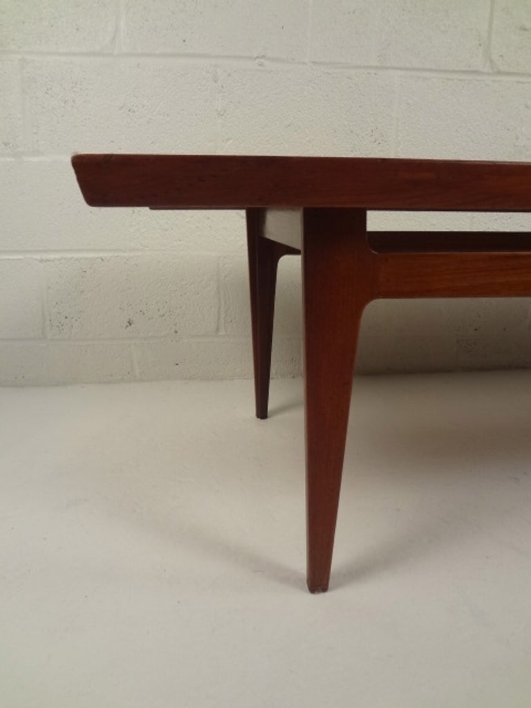Long solid teak sofa table designed by Finn Juhl in 1959 and produced by France & Son.
(Please confirm item location - NY or NJ - with dealer).
 