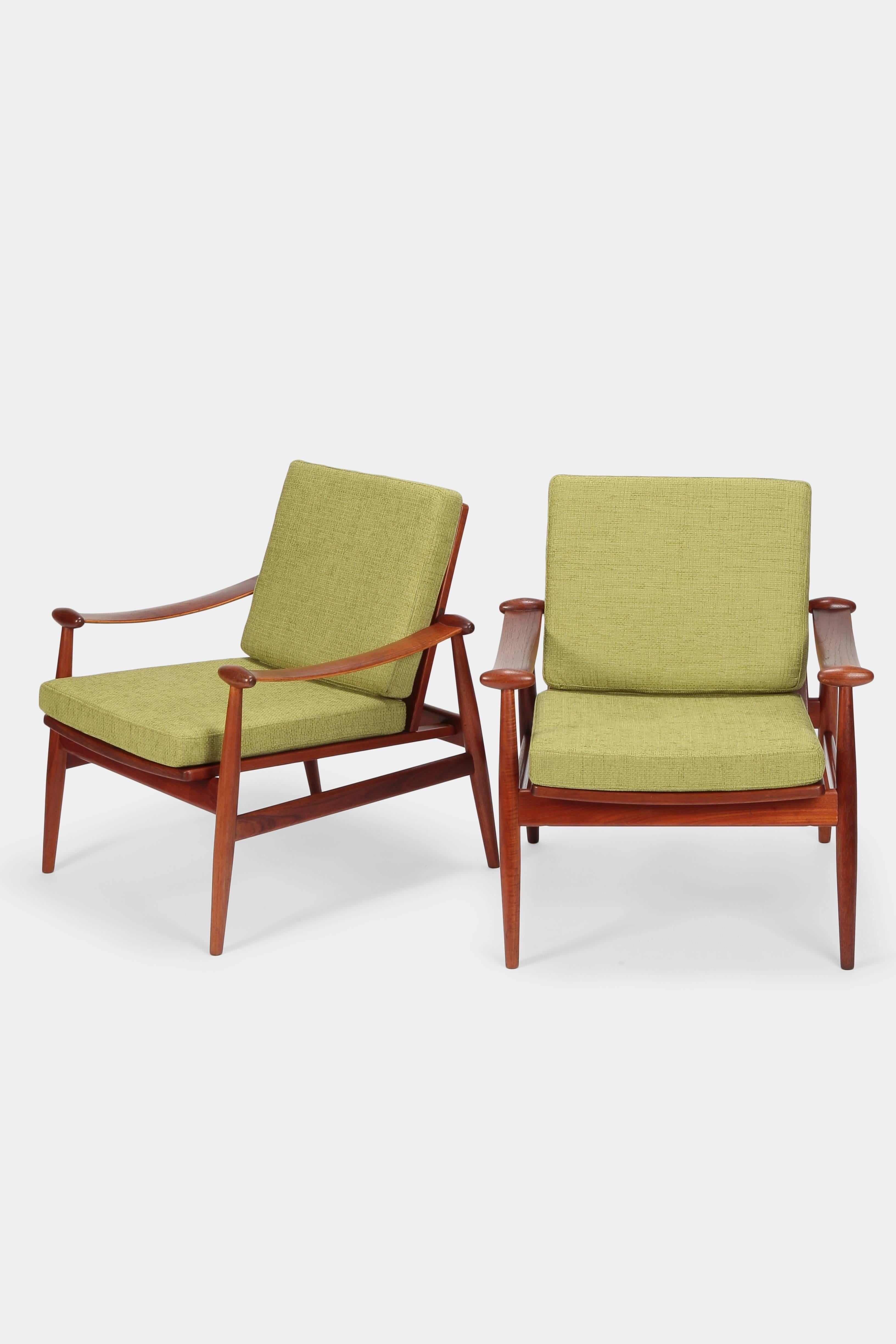 Finn Juhl “Spade” lounge chairs model 133 manufactured by France & Daverkosen in the 1960s in Denmark. Stunning chairs with a refined teak wood frame and brass hardware. Foam cushions and the cotton blend covers were renewed in the 1980s. This was
