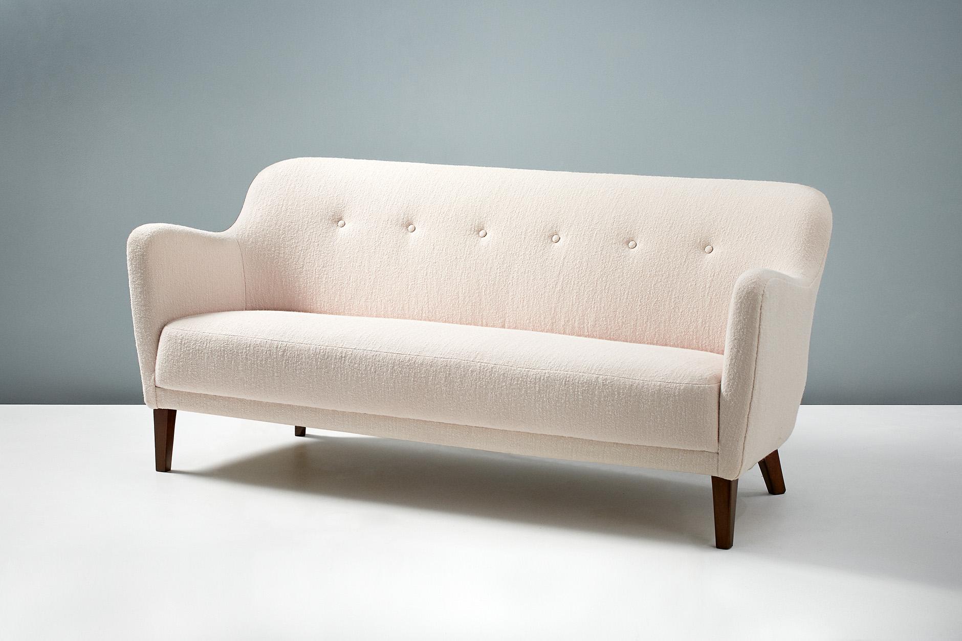 Danish cabinetmaker made sofa in the manner of Finn Juhl, produced in Denmark, circa 1940s.

The sofa has been completely reconditioned by our in-house team of upholsterers at our workshops in London. We have recovered the sofa in luxurious,