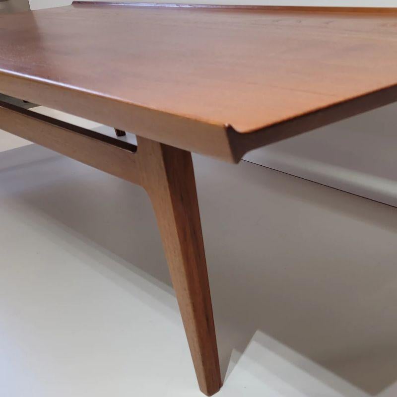 Graceful and rarely seen Model 500 teak coffee table designed by Finn Juhl and produced by France & Son, Denmark.

This shape table would be a wonderful focal point to a large square room. It is nice and low which is ideal for placing in front of a