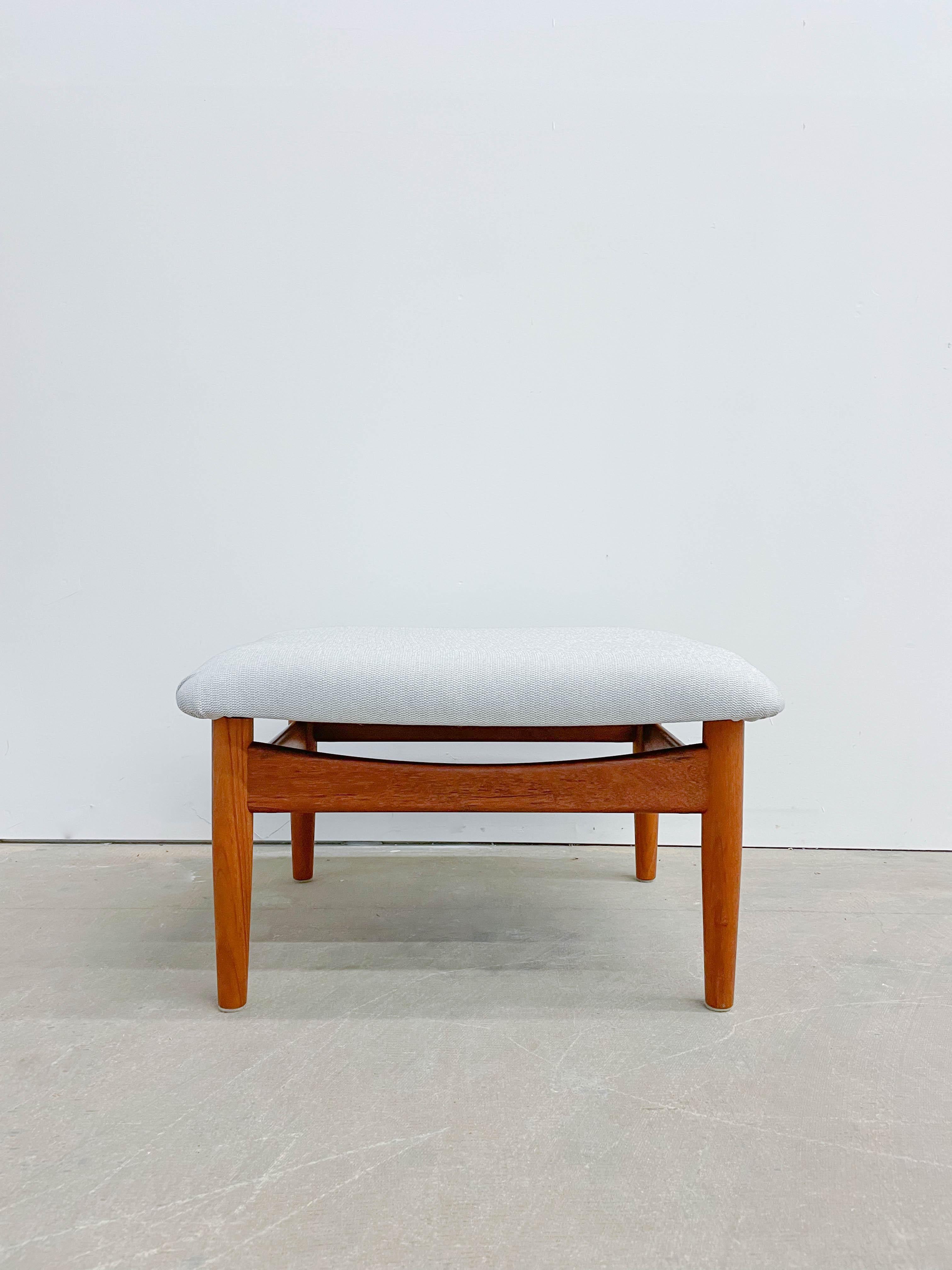 Finn Juhl is arguably the master of Danish mid-century modern design, and this ottoman is no exception. This is a Finn Juhl Japan Chair ottoman designed to be paired with a classic Japan Lounge Chair. However, it pairs just as well with a number of