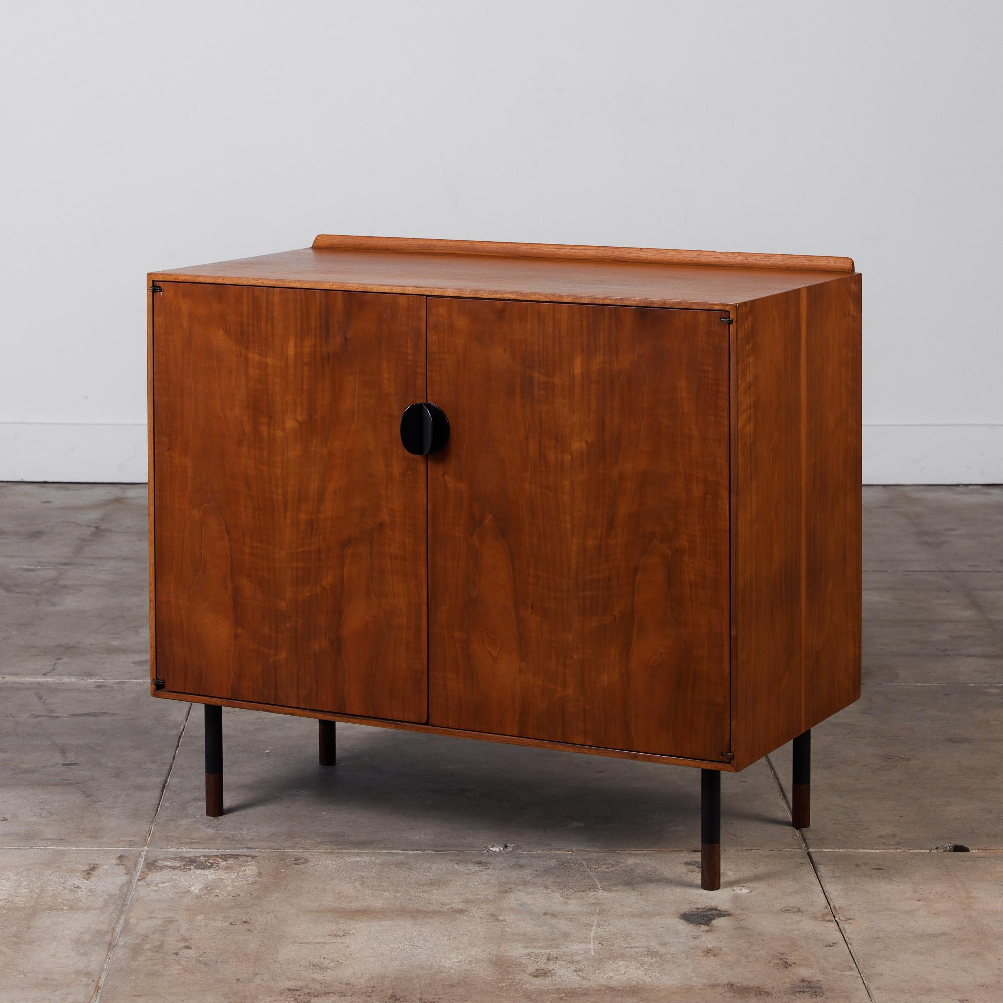 Finn Juhl designed this walnut cabinet for American manufacturer Baker furniture in the 1950s for their 