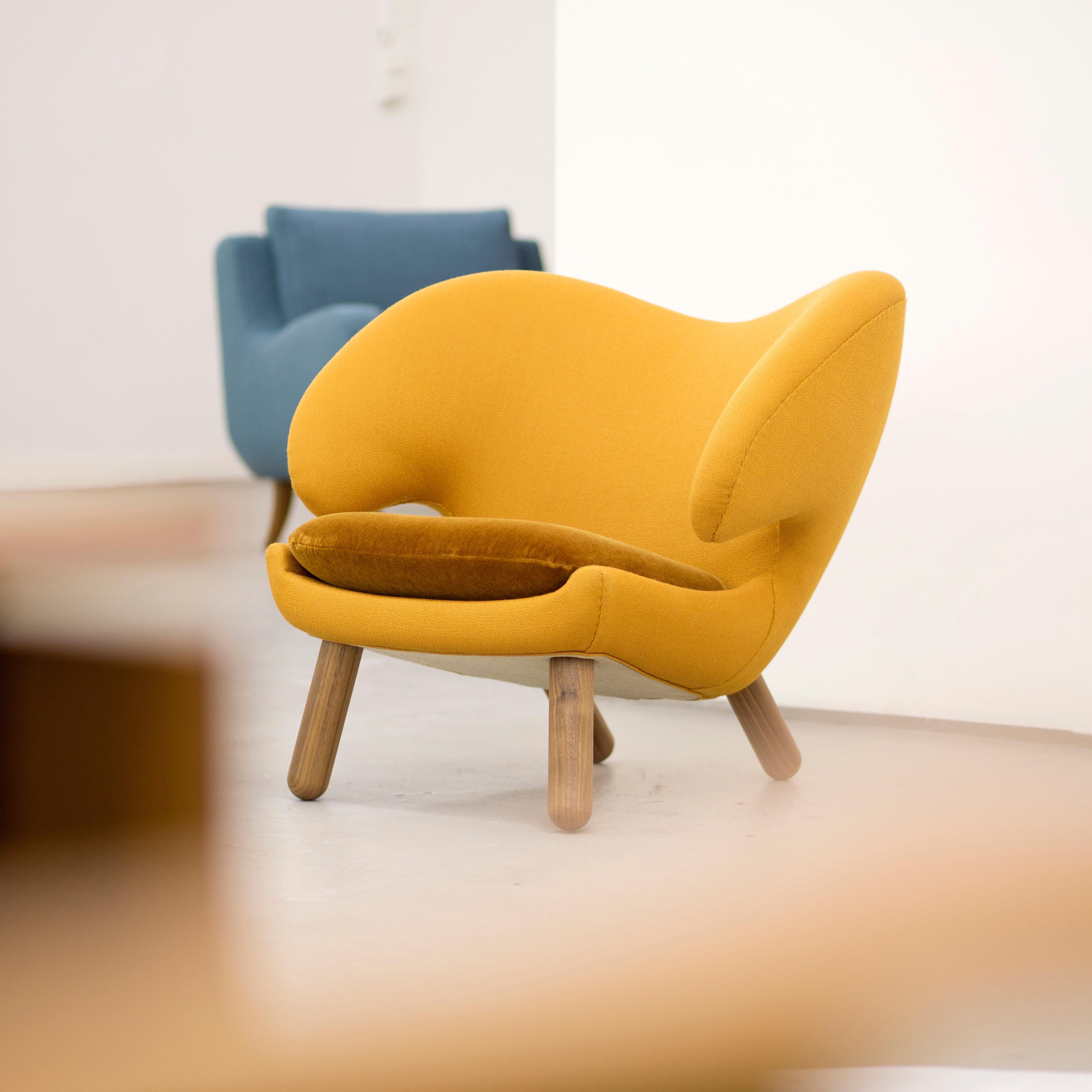 Pelican chair designed by Finn Juhl in 1940.
Manufactured by House of Finn Juhl in Denmark.

Pelican chair was probably the one furthest ahead of its time. When it was presented at the Copenhagen Cabinetmakers’ Guild Exhibition in 1940, it stood