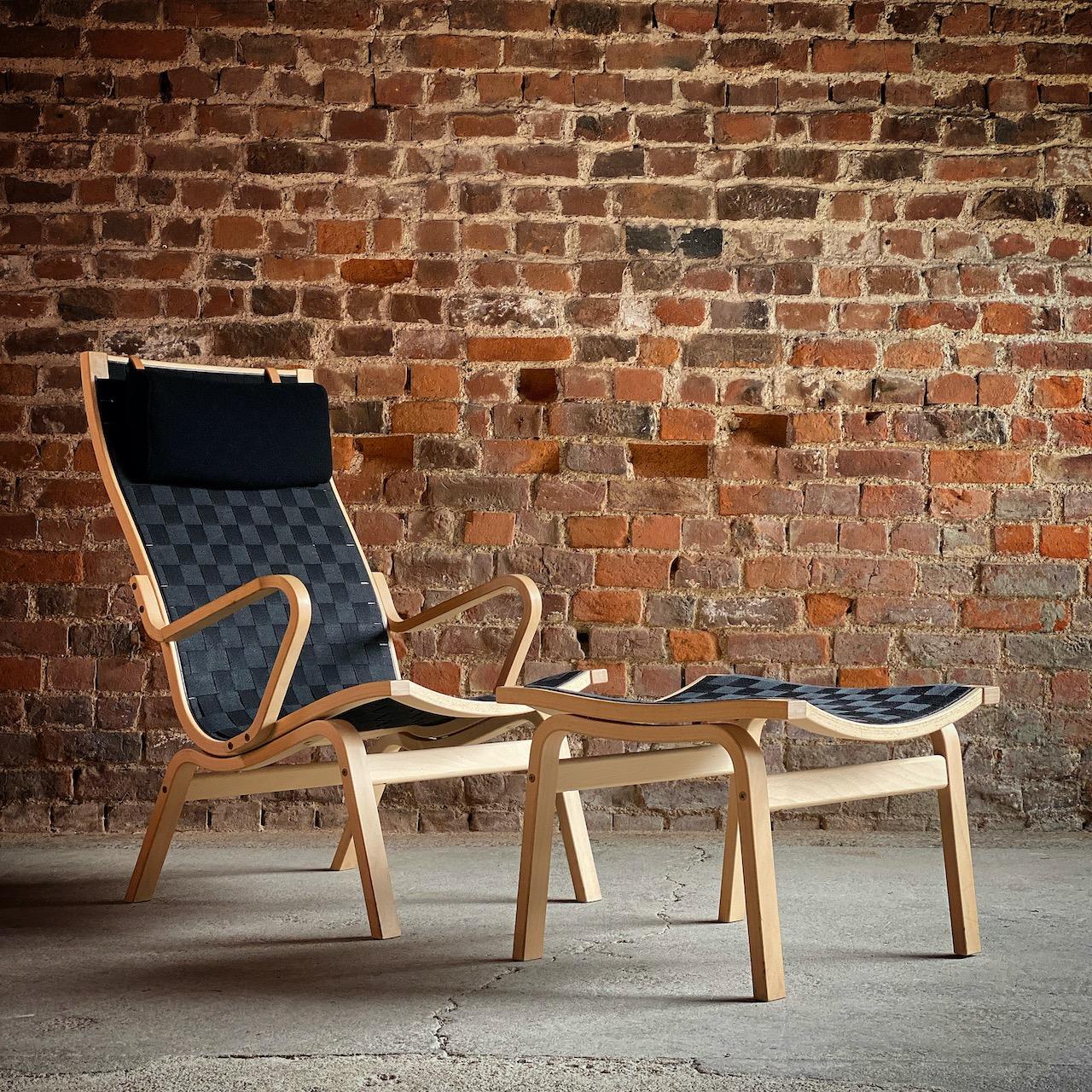 Finn Ostergaard Albert chair Model 4100 Danish midcentury

Finn Østergaard ‘Albert' Series 4100 armchair and stool by Skipper Mobler designed in Denmark 1978, the high-backed frame made from moulded beech bentwood, upholstered in black woven
