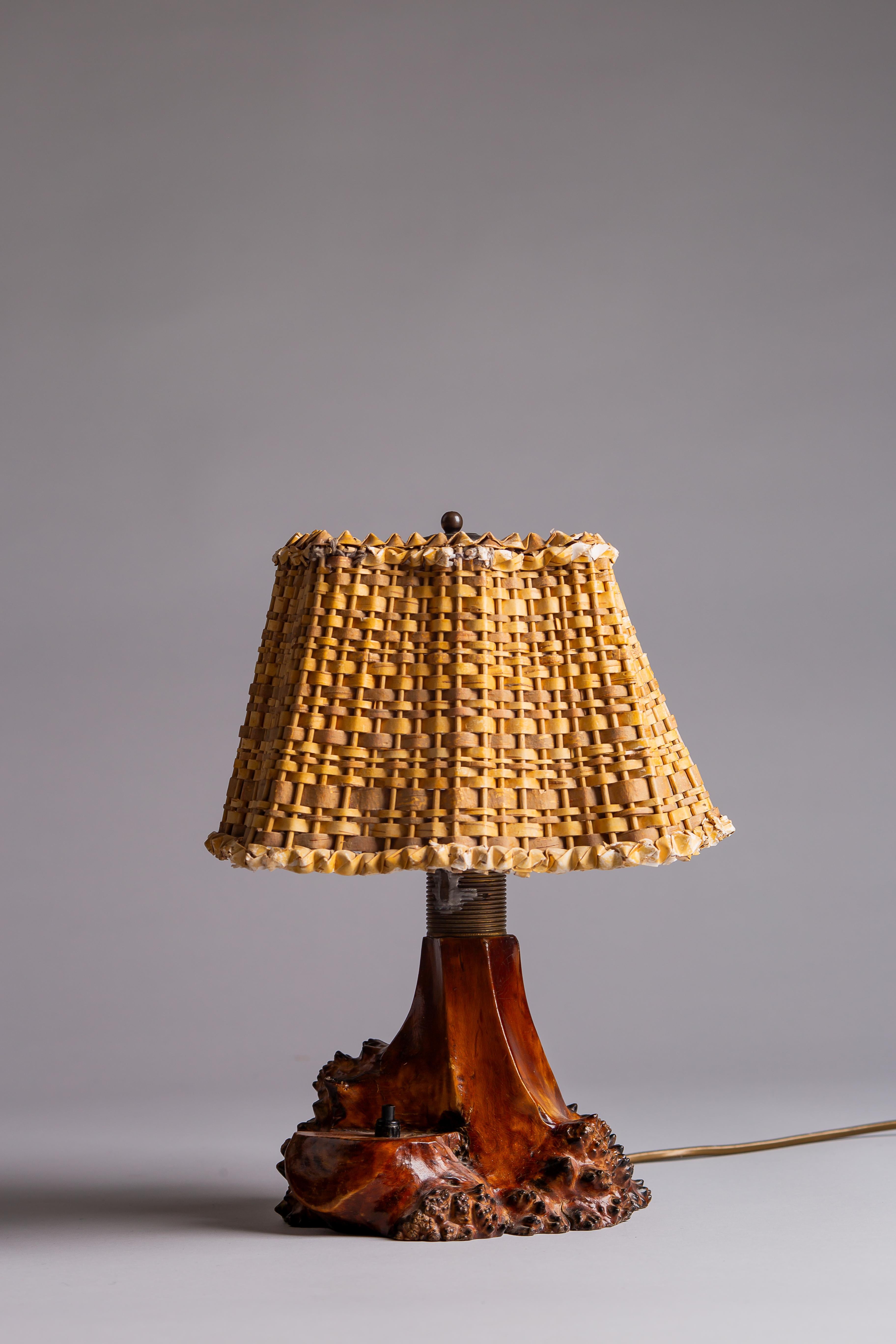 Unearth a blend of history and design with this Finnish 1940s curly birch table lamp. War-time made, this piece embodies the raw elegance of brutalist aesthetics with a unique birch bark lampshade that tells tales of resilience and craftsmanship.