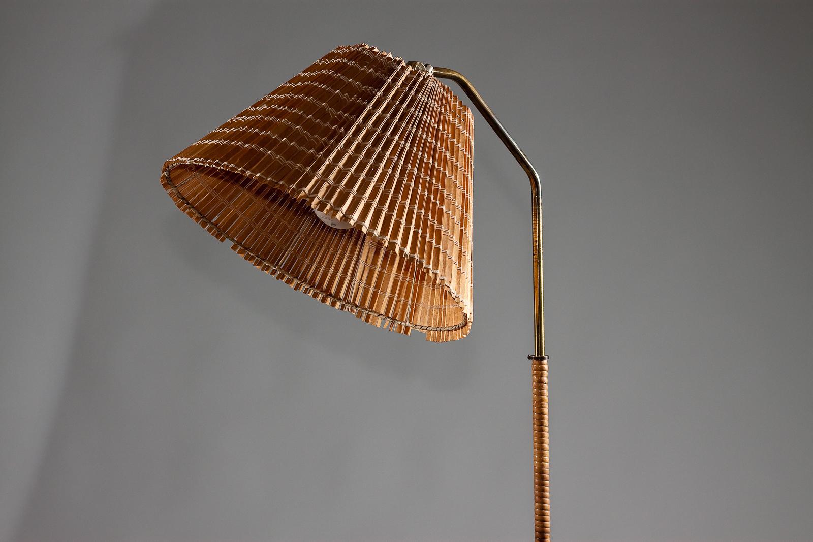 20th Century Finnish 1950's brass floor lamp with wrapped rattan stem and wooden slat shade