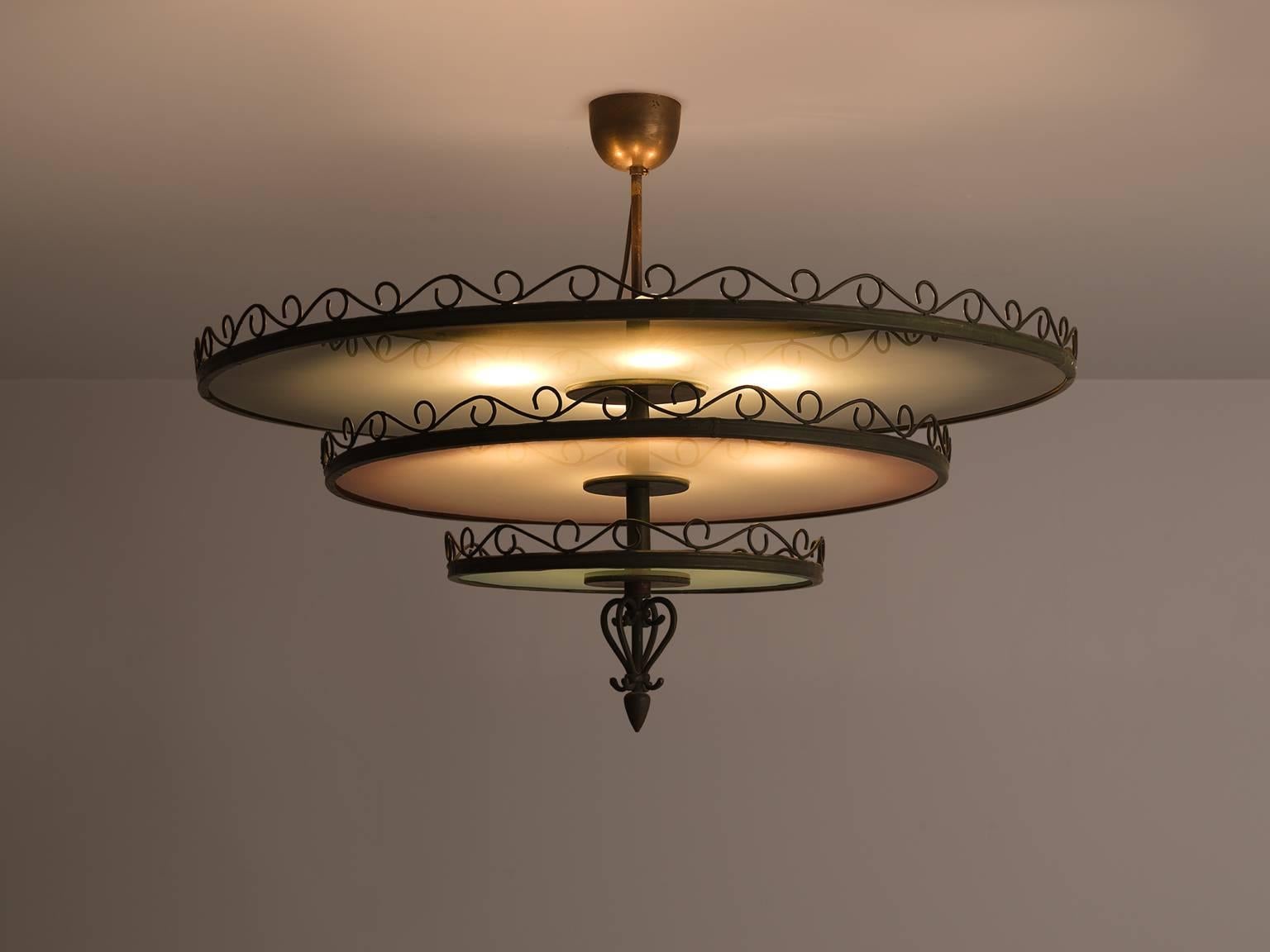 Chandelier glass metal brass, Finland, circa 1930.

This Art Deco chandelier with eloquent forgings and three different shades of glass is both refined and robust at the same time. The chandelier is built up of three different layers in various