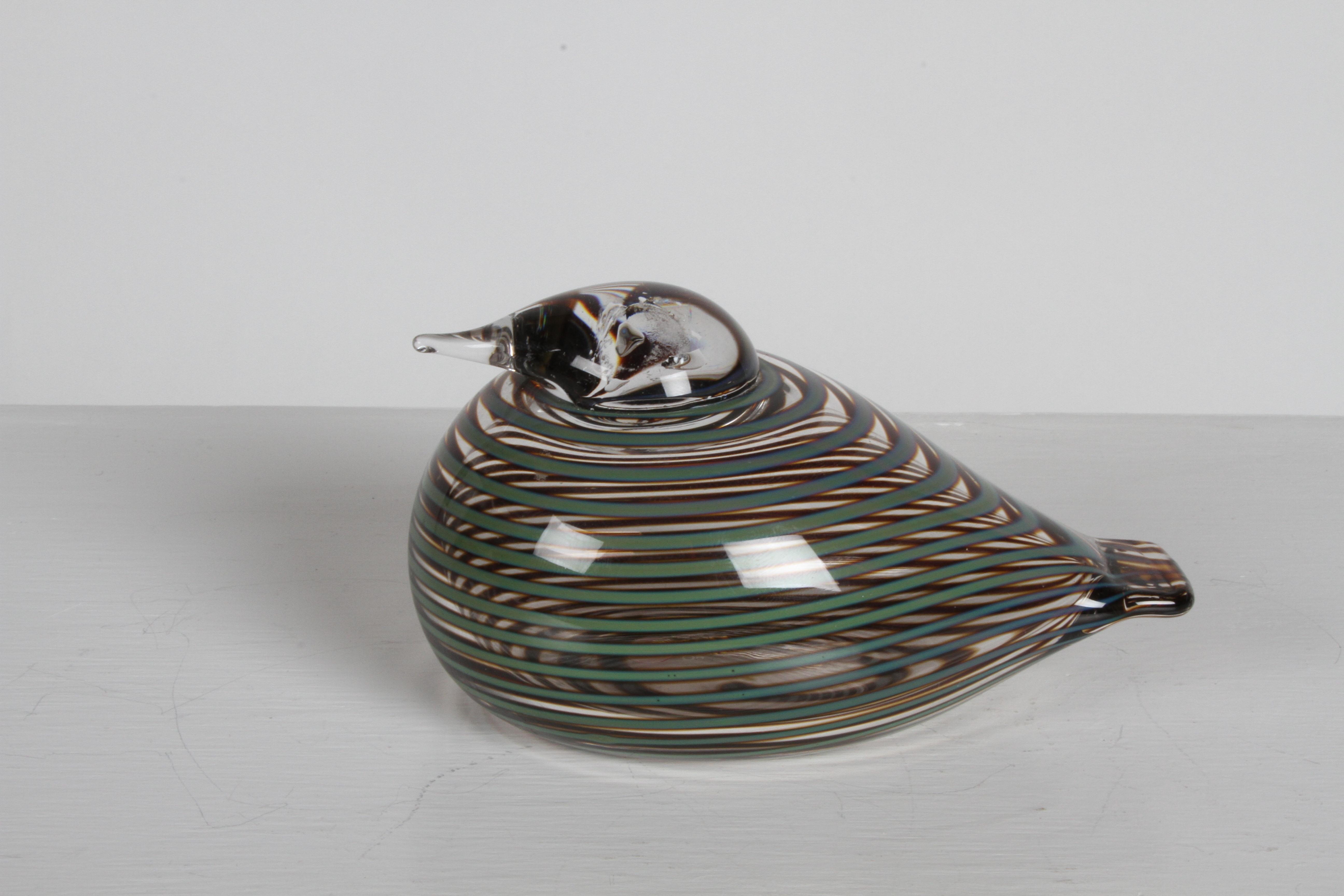 Renowned Finnish glass artist Oiva Toikka designed whippoorwill or willow duck with bands of olive green stripes running around an otherwise transparent body. In fine used condition. Signed.
 