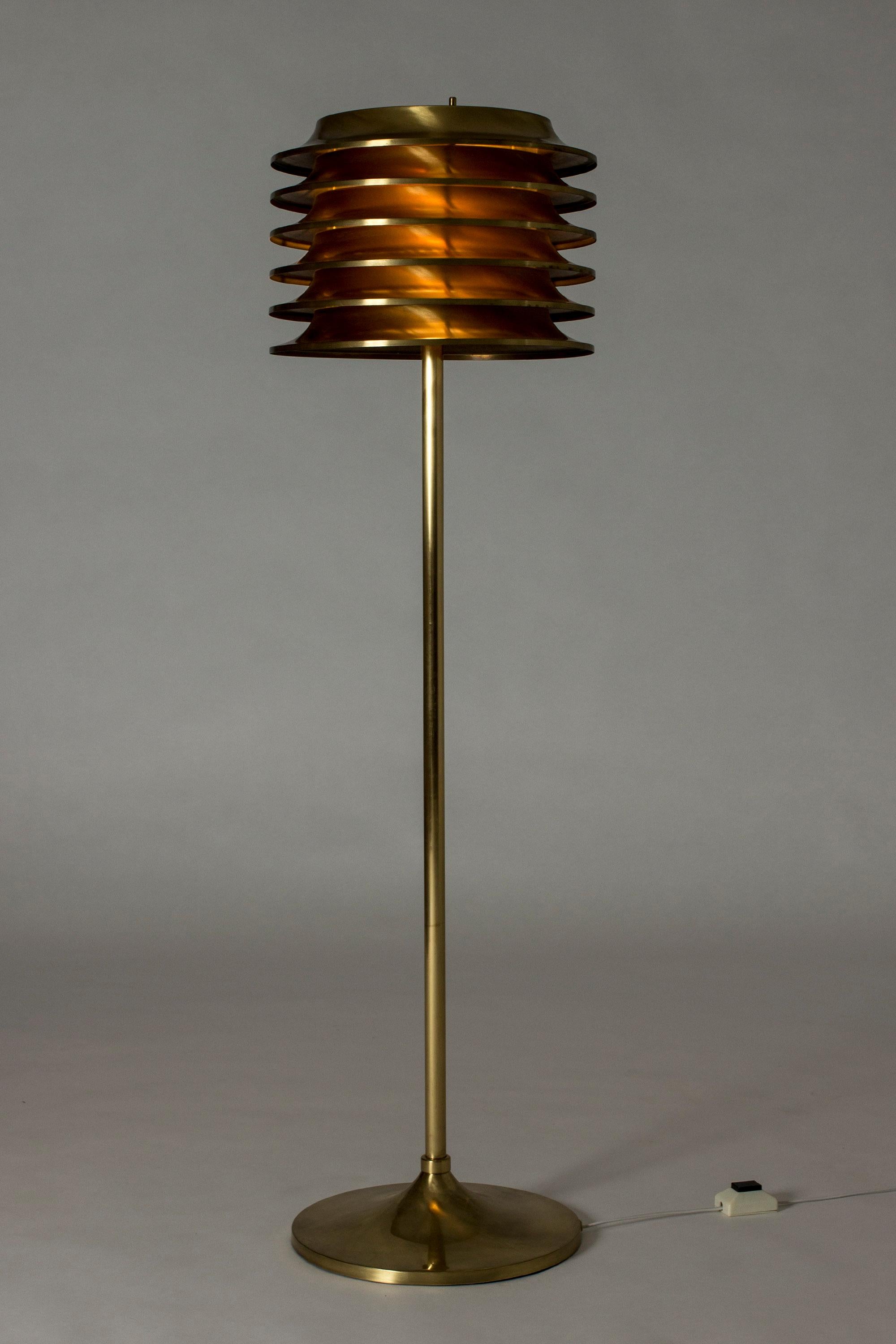 Very cool brass floor lamp by Kai Ruokonen, with a large lamella lamp shade. Sends out beautiful, warm light when lit.