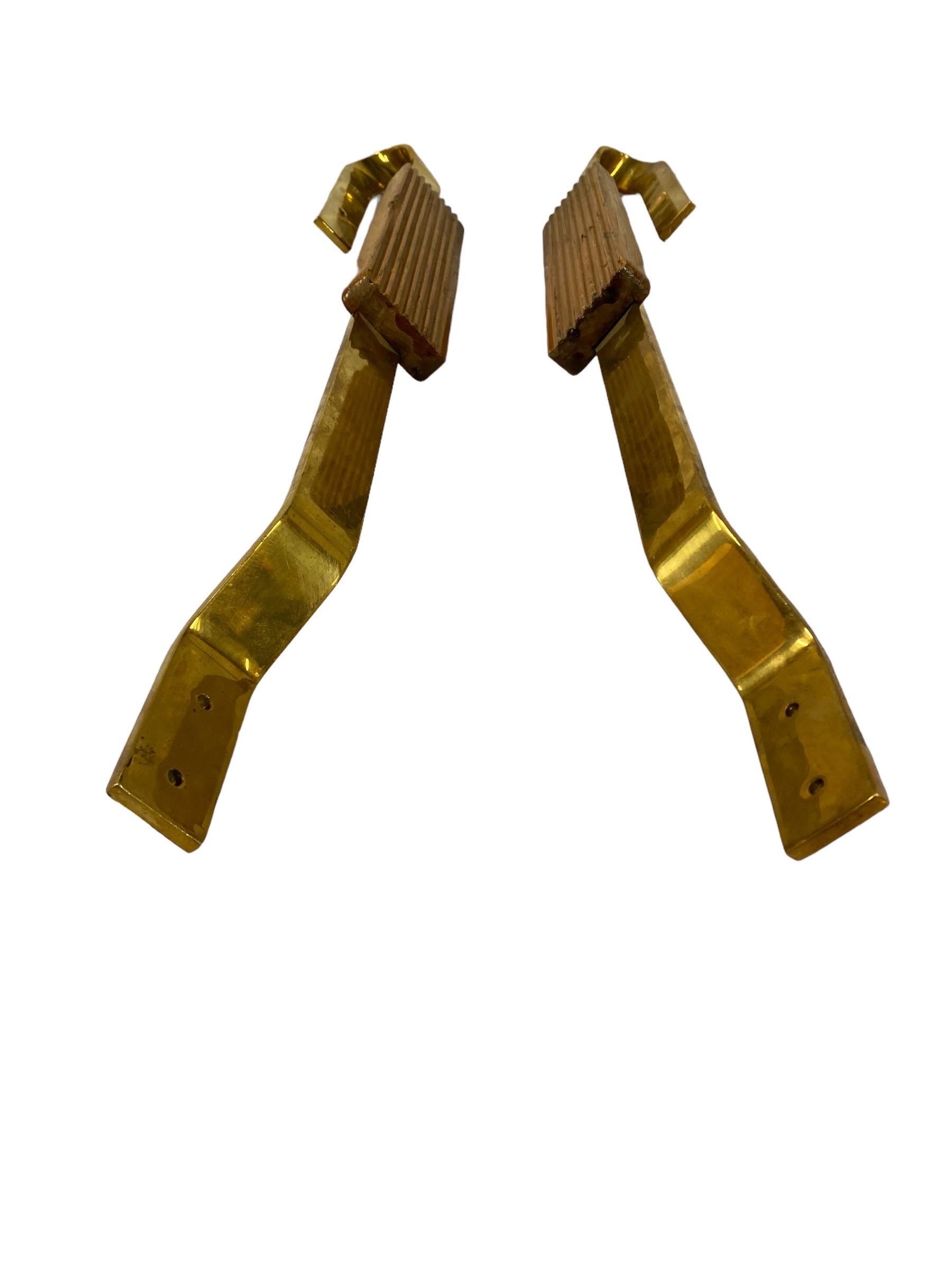 Two very distinct and elegant Finnish door handles in brass and oak wood. Very practical yet stand out pieces with guaranteed quality, craftsmanship, and design. 
Unfortunately we don't know the provenance for this pair, but most likely they were