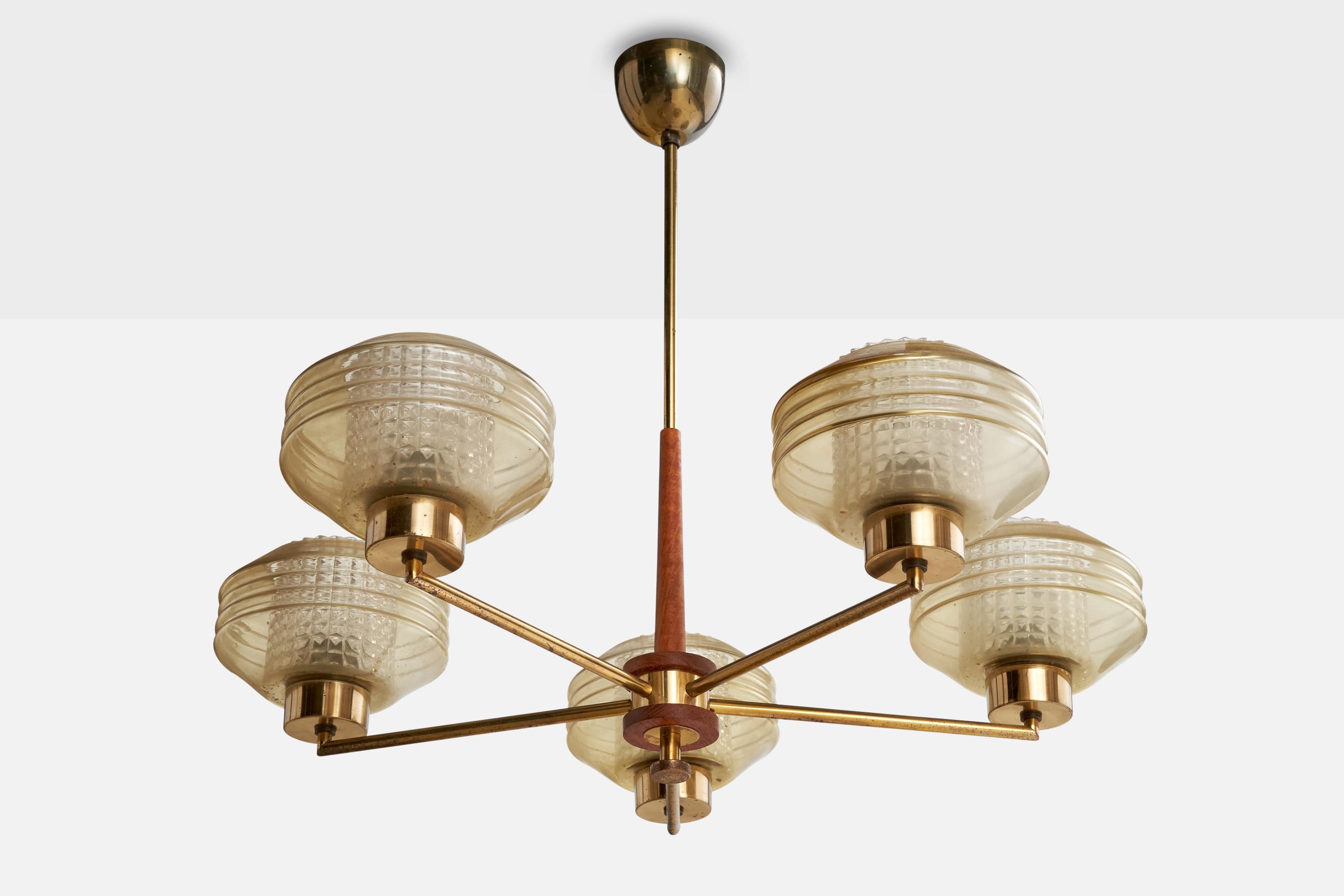 A brass, teak and glass chandelier designed and produced in Finland, c. 1950s.

Overall Dimensions (inches): 21” H x 24.5” Diameter

Dimensions of Canopy:  2.5” H x 3.25” diameter

Stem length: 8.75” H

Bulb Specifications: E-26 

Number of Sockets: