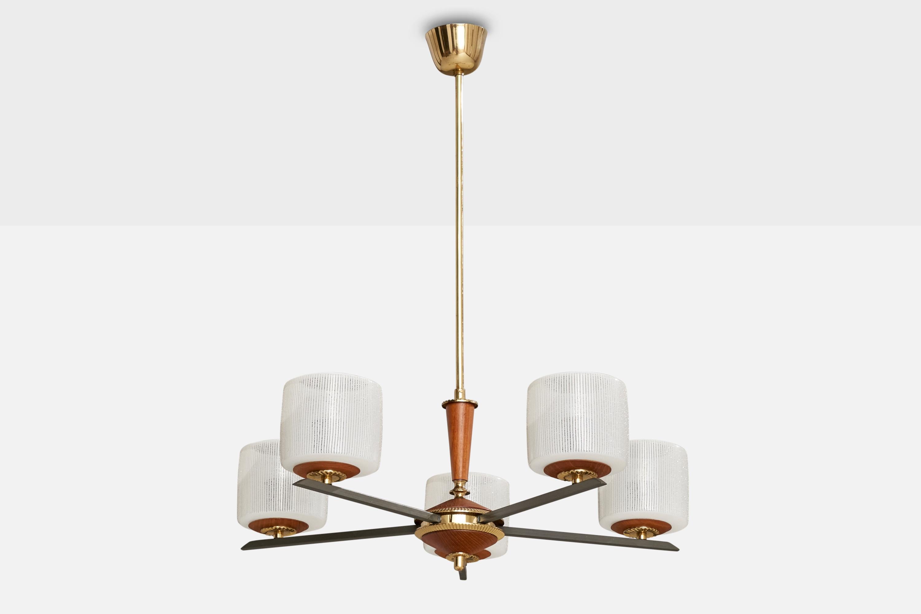A brass, metal, teak and etched glass chandelier designed and produced in Finland, c. 1950s.

Overall Dimensions (inches): 28.5” H x  24” Diameter
Dimensions of Canopy: 2.25 ” H x 3.375” D
Stem length: 17.375 ”H
Bulb Specifications: E-26 