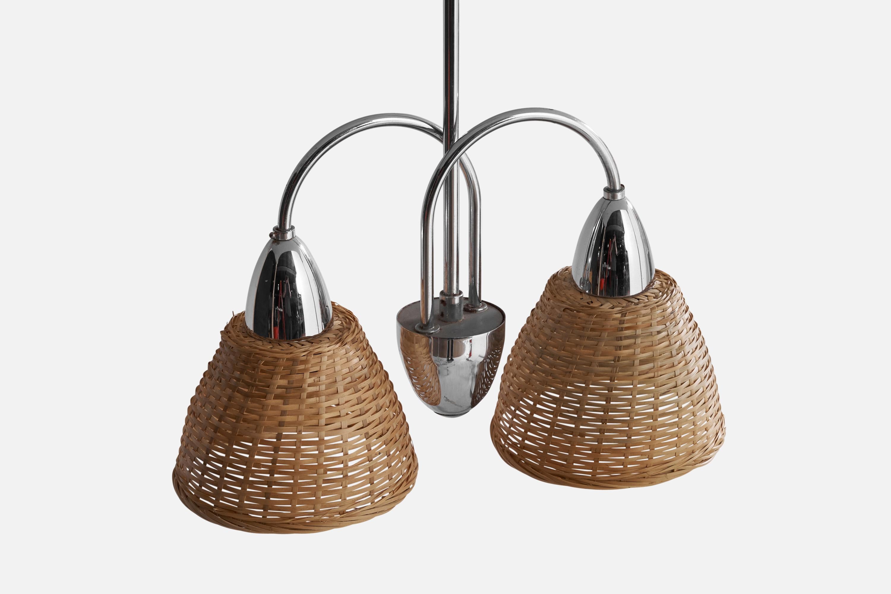 A two-armed chrome and rattan chandelier designed and produced in Finland, 1940s.

Dimensions of canopy (inches): 3.4” H x 2.52” Diameter
Socket takes standard E-26 bulbs. 2 sockets.There is no maximum wattage stated on the fixture. All lighting