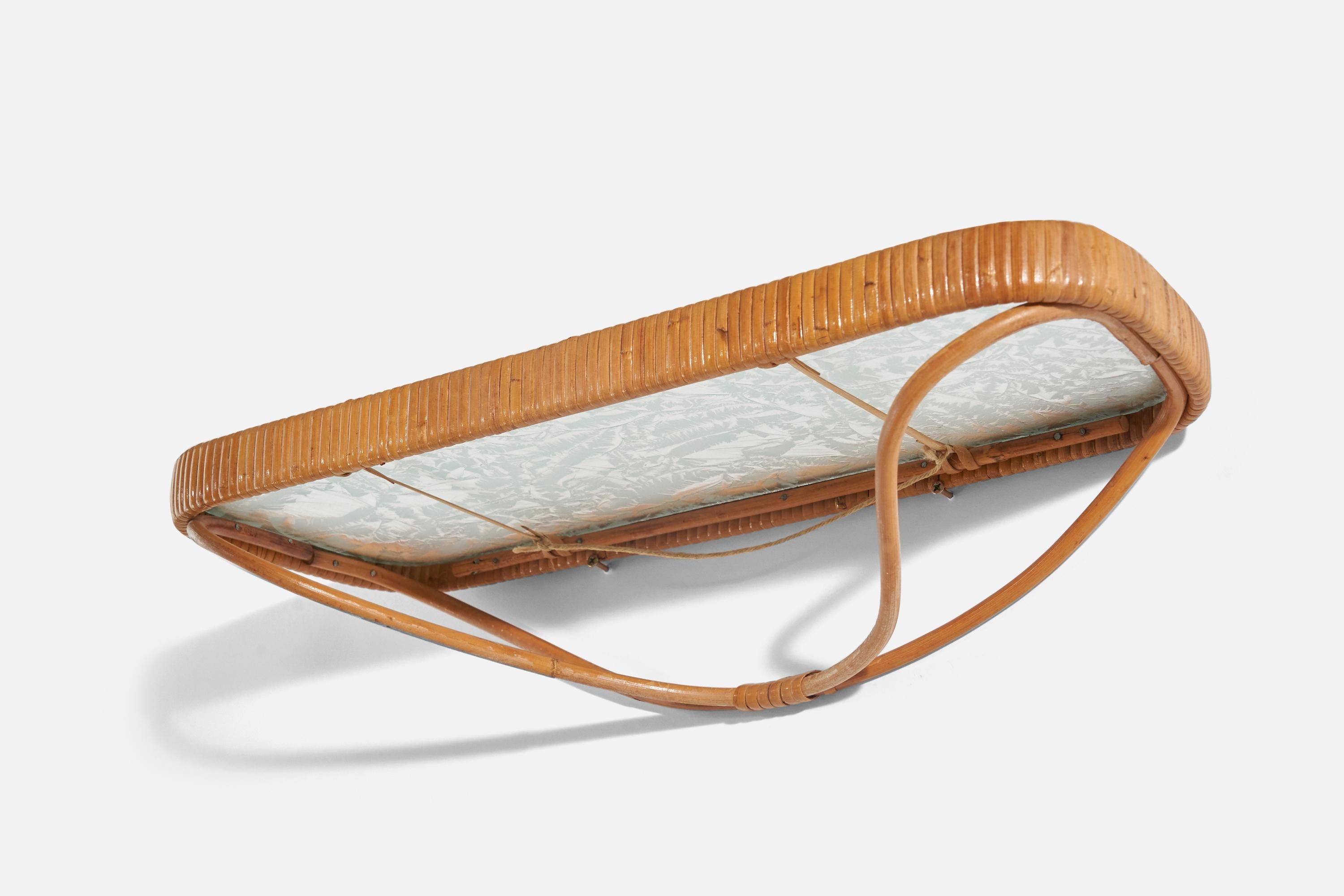 A rattan, bamboo and glass console or wall shelf designed and produced in Finland, 1950s.