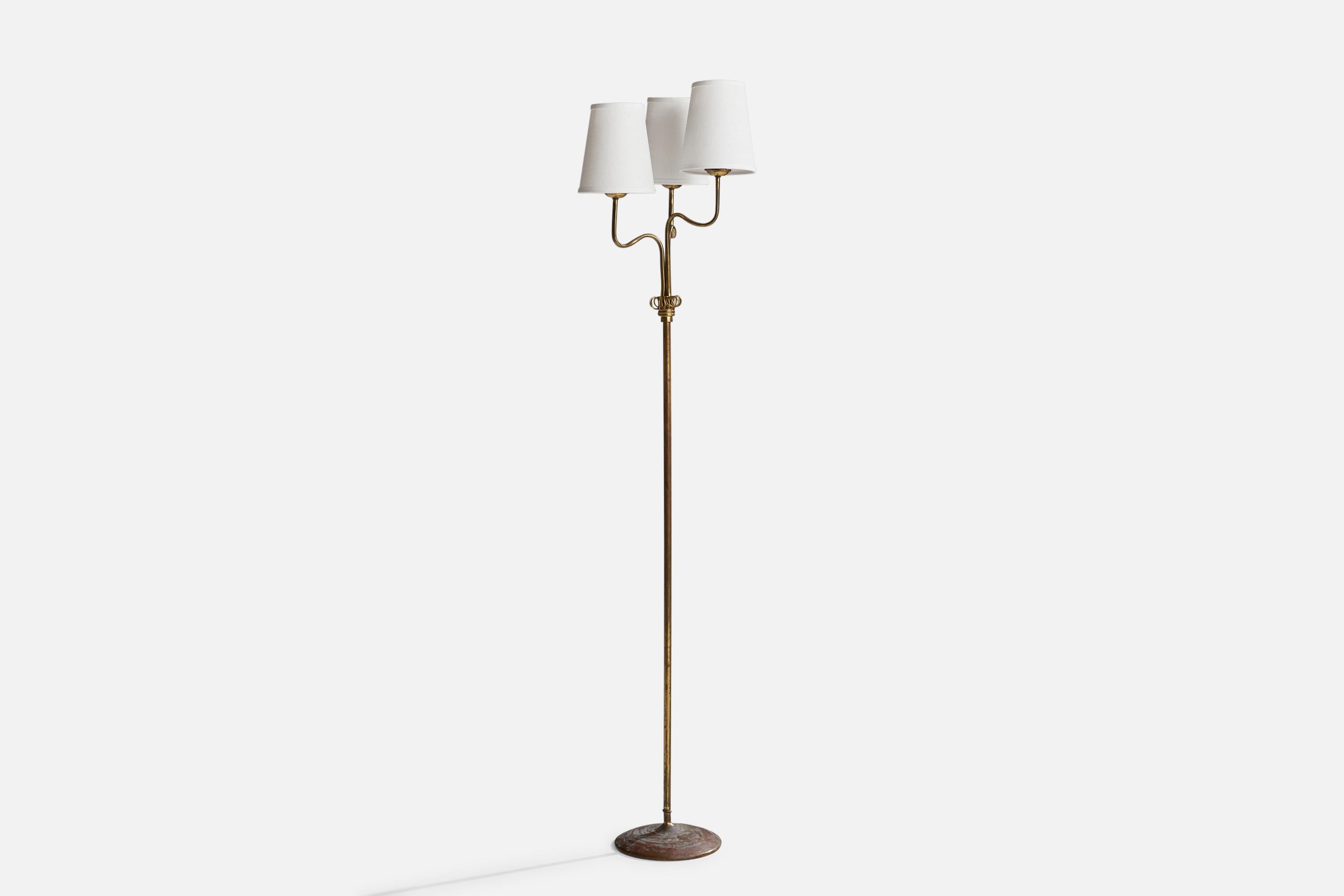 A brass and white fabric floor lamp designed and produced in Finland, c. 1940s.

Dimensions of Lamp (inches): 58” H x 9” Diameter
Dimensions of Shade (inches): 4”  Top Diameter x 6” Bottom Diameter x 7” H
Dimensions of Lamp with Shade (inches): 62.5