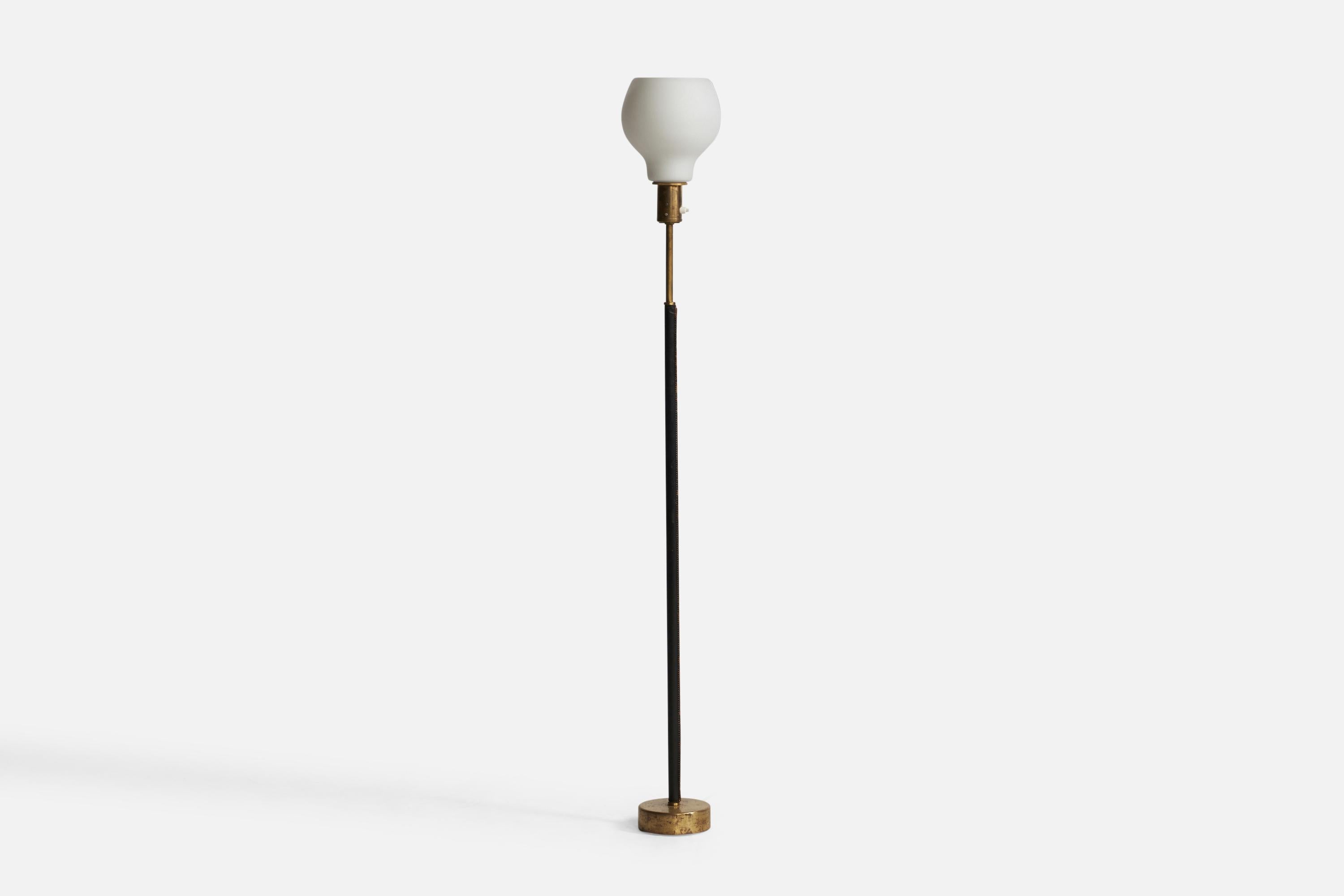 A brass, black-dyed leather and opaline glass floor lamp designed and produced in Finland, c. 1950s.

Overall Dimensions (inches): 58.75” H x 7.65” Diameter. Stated dimensions include shade.

Bulb Specifications: E-26 Bulb

Number of Sockets: 1

All