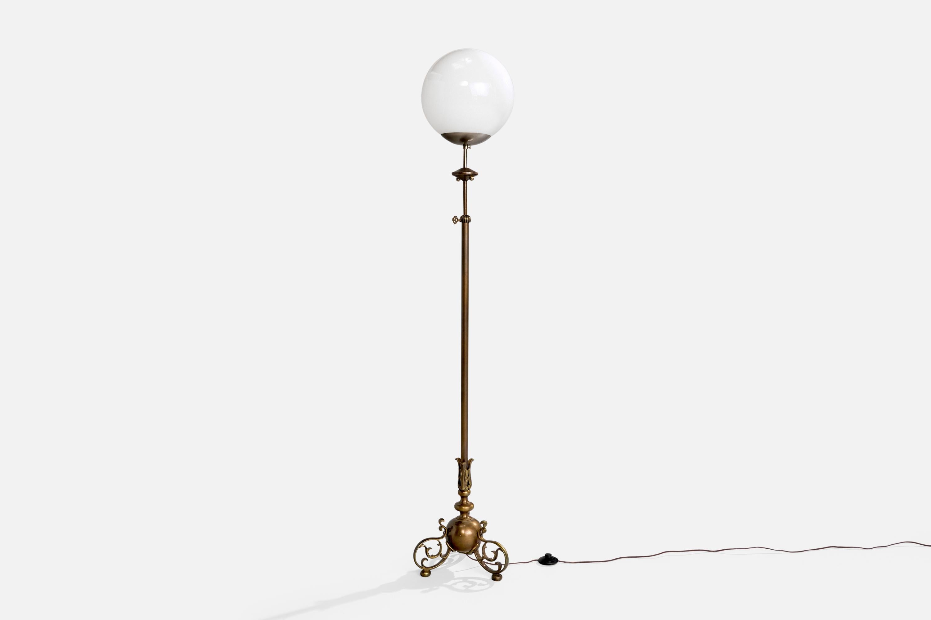 An adjustable brass, metal and white opaline glass floor lamp designed and produced in Finland, c. 1970s.

Dimensions of Lamp with Shade (inches): 67” H x 13“ Diameter

Bulb Specifications: E-26 Bulb

Number of Sockets (per fixture): 1

Sold with