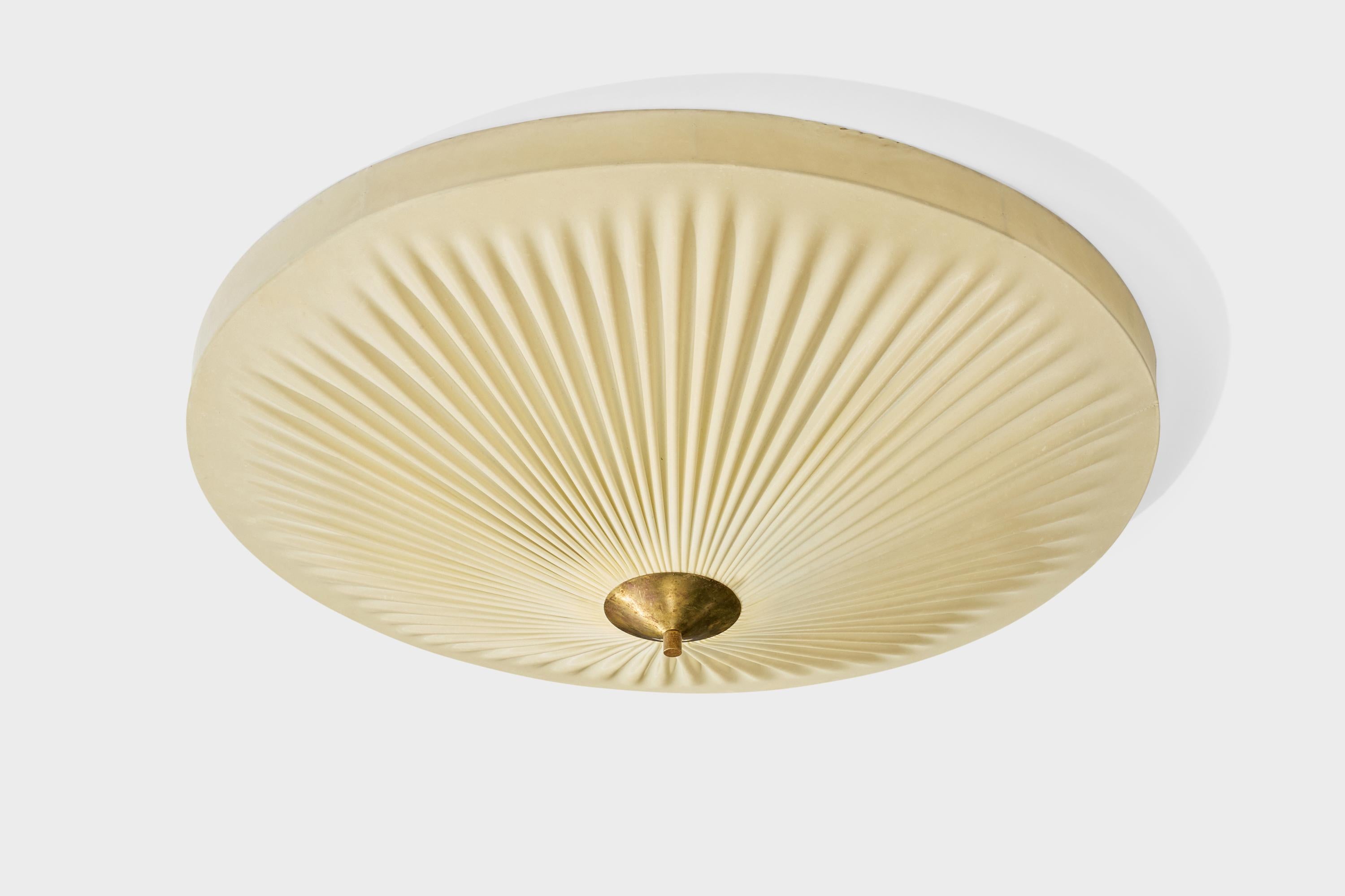 A cream-white resin-coated fabric and brass flush mount designed and produced in Finland, c. 1940s.

Overall Dimensions (inches): 9.5