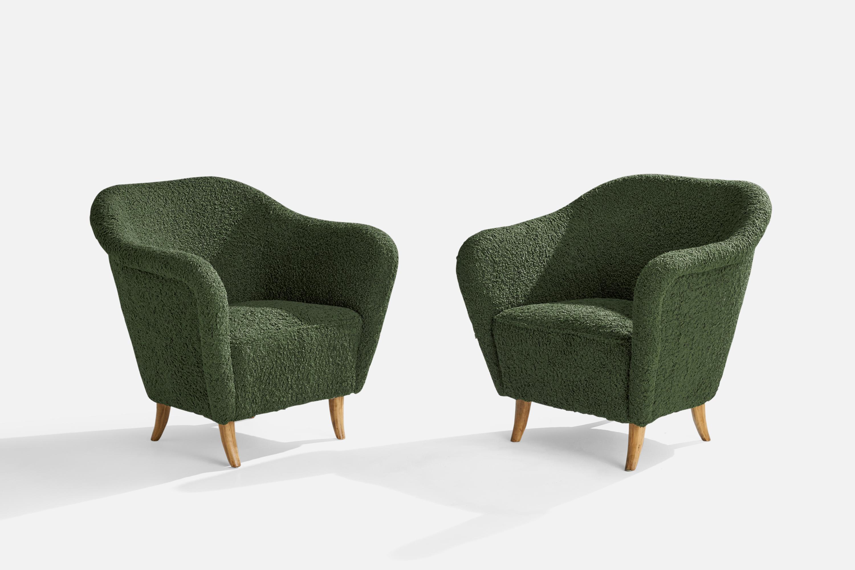 A pair of green bouclé fabric and birch lounge chairs designed and produced in Finland, 1940s.

Seat height 16.5”.