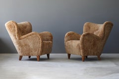 Finnish Designer, Organic Lounge Chairs, Sheepskin, Stained wood, Finland, 1940s