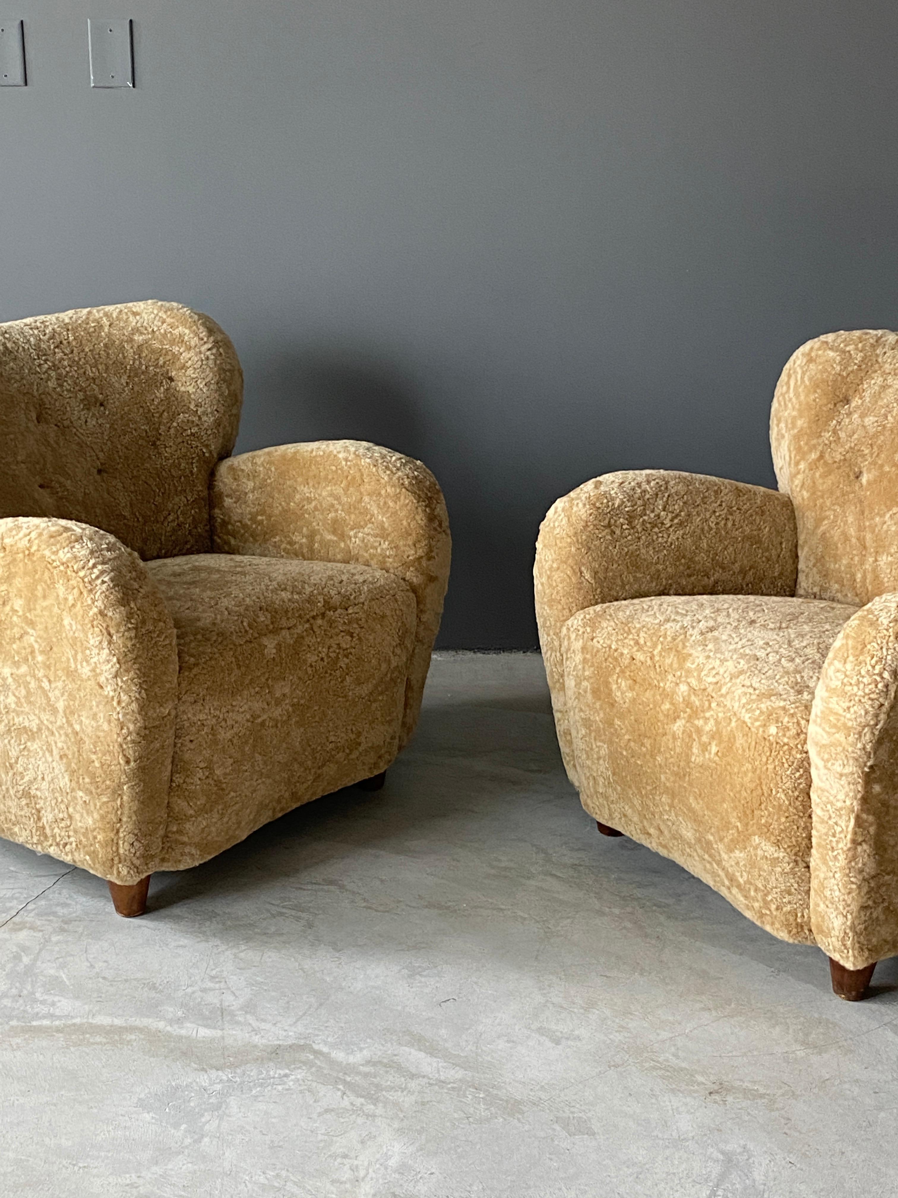 Finnish Designer, Organic Lounge Chairs, Sheepskin, Stained Wood, Finland, 1940s In Good Condition In High Point, NC