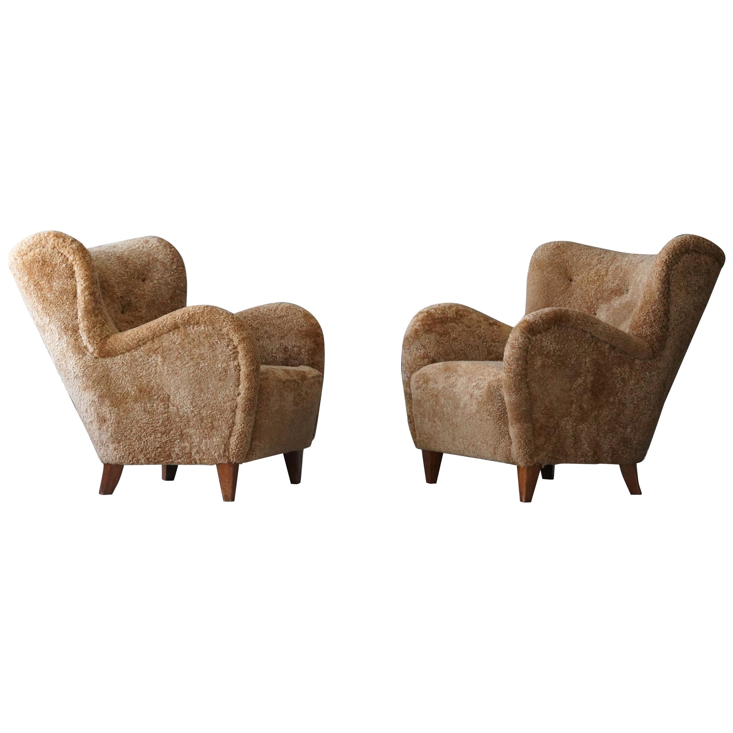 Finnish Designer, Organic Lounge Chairs, Sheepskin, Stained wood, Finland, 1940s