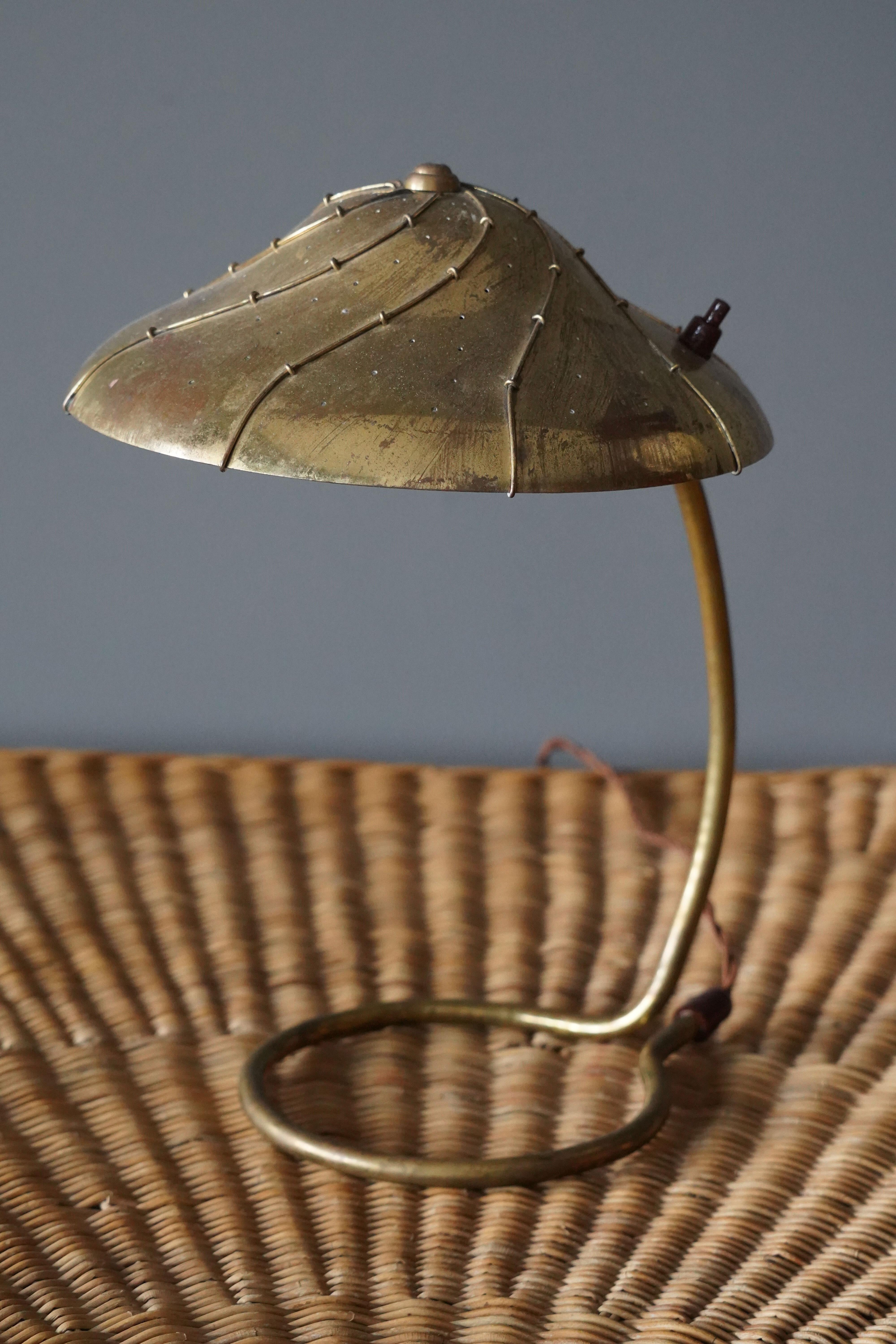 A table lamp, designed and produced in Finland, 1930s. In brass. 

Other designers of the period include Paavo Tynell, Lisa Johansson-Pape, Alvar Aalto, Tapio Wirkkala, Ilmari Tapiovaara.