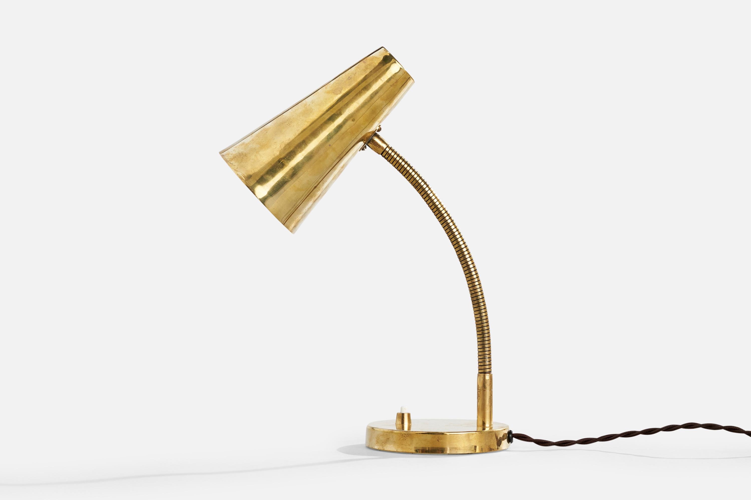An adjustable brass table lamp designed and produced in Finland, c. 1950s.

Dimensions of Lamp with Shade (inches): 13“ H x 4.75” W x 10.25“ D (adjustable; measured as shown)

Bulb Specifications: E-26

Number of Sockets (per fixture): 1

Sold with