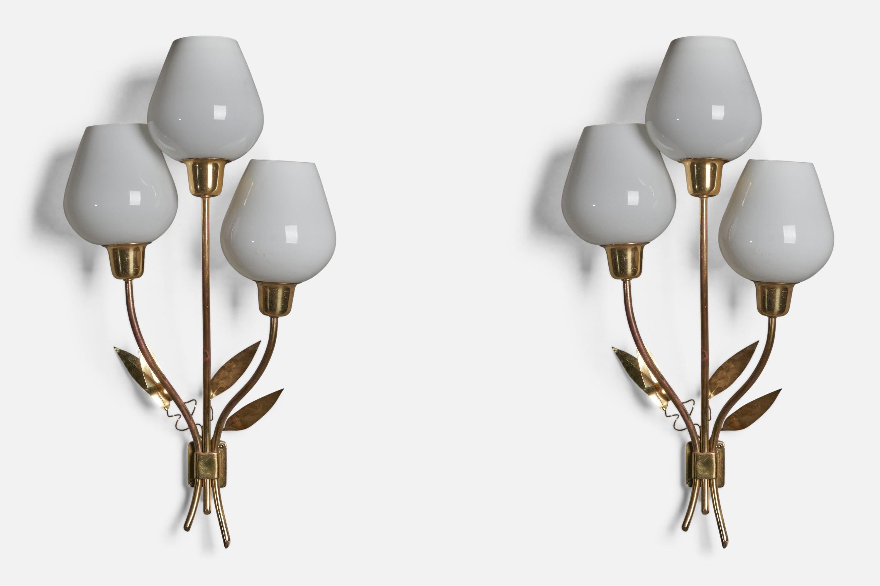 A pair of three-armed brass and white opaline glass wall lights, designed and produced in Finland, 1950s.

Overall Dimensions (inches): 25” H x 13” W x 6” D

Bulb Specifications: E-26 Bulb

Number of Sockets: 3