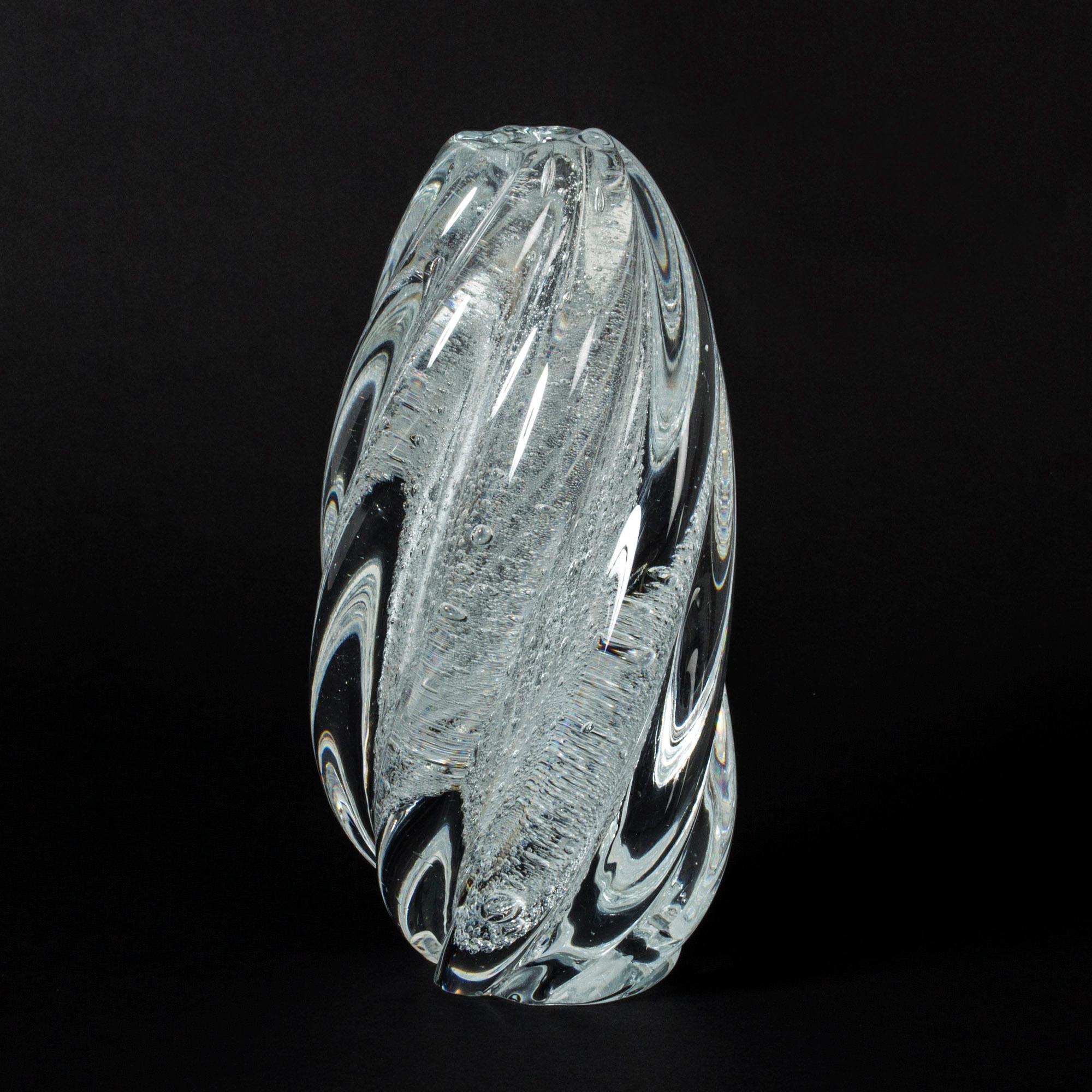 Beautiful hand blown glass vase by Tapio Wirkkala. Twisted form with a flow of air bubbles caught inside. Striking appearance of movement, like a current.