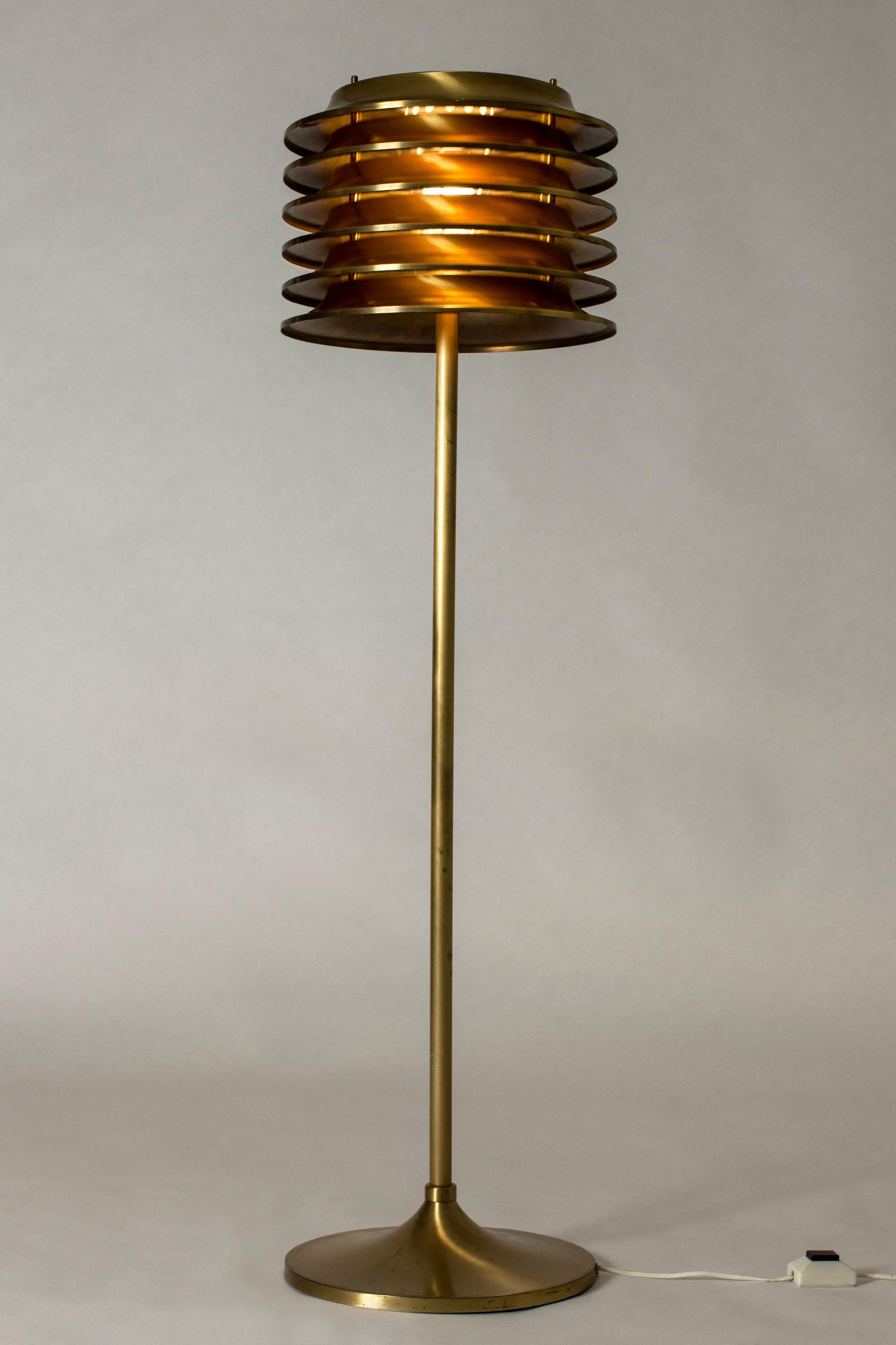 Very cool brass floor lamp by Kai Ruokonen, with a large lamella lamp shade. Sends out beautiful, warm light when lit.