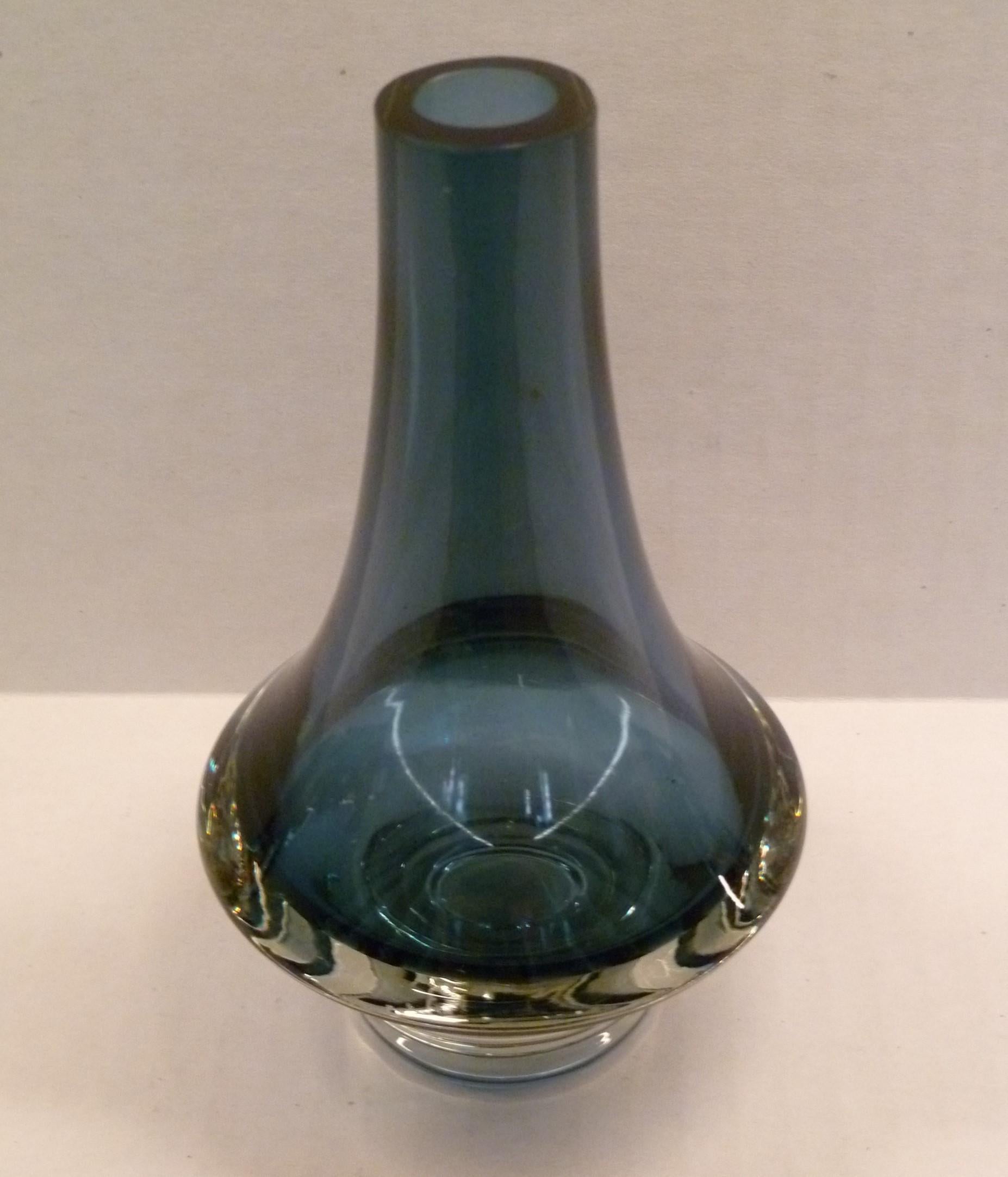 Finnish modern glass vase by Erkkitapio Siiroinen (1944-1996) for Riihimaki, Finland. From 1970 in dark blue-gray body color with a clear thick base engraved with model # 1379 on the bottom.

Riihimaki was founded in 1910 and became the largest