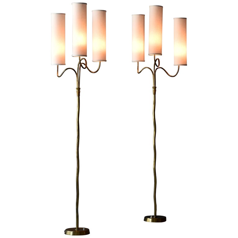Pair of brass floor lamps, 1950s, offered by Ponce Berga