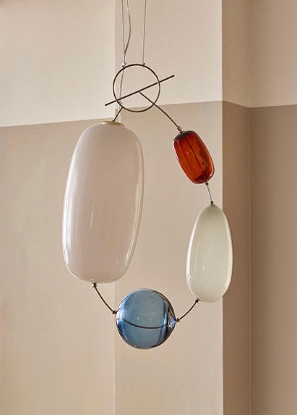 Exceptional pendant made out of mouth blown glass and stainless steel. 
A quality contemporary design by Finnish designer Katriina Nuutinen. 
The design was originally designed in 2009 and made in a sold out limited edition of only 200 pieces