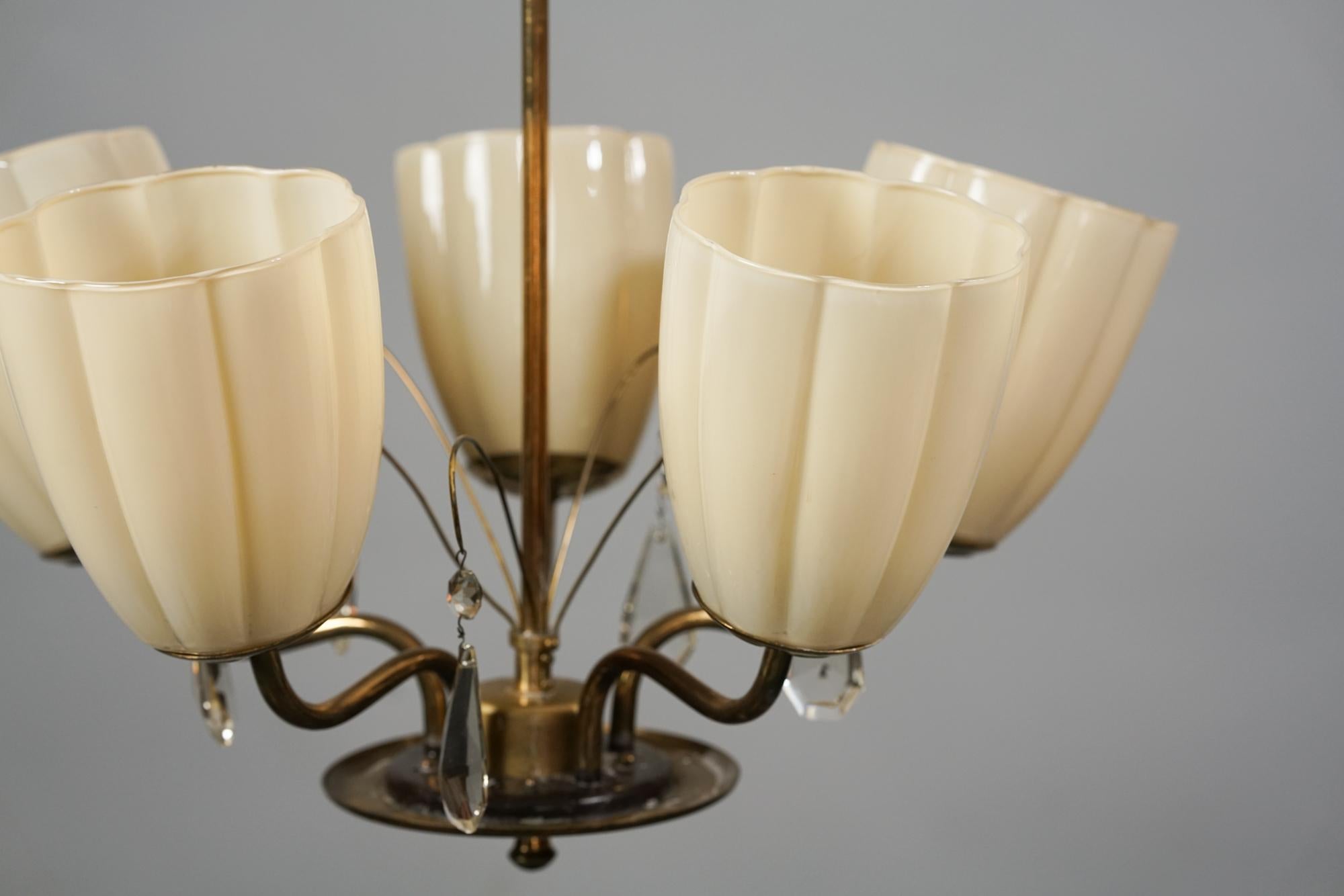 Finnish chandelier by unknown designer from the 1950s. Opaline glass, brass frame, crystal details. Beautiful classic Scandinavian Modern design reminiscences of Taito oy and Orno chandeliers. The chandelier is in good vintage condition, minor wear