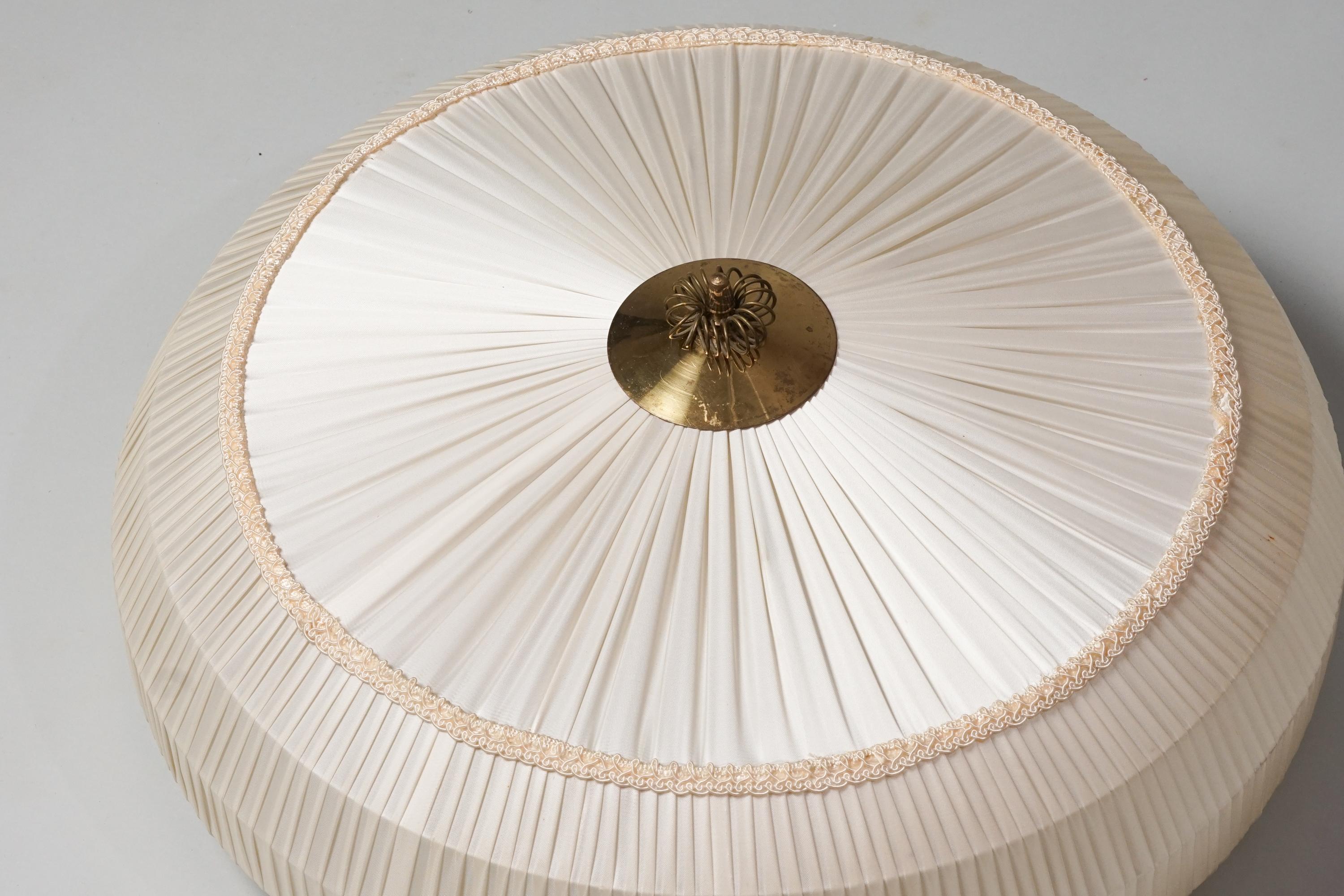 Finnish silk flush mount, 1950/1960s. Silk shade with beautiful brass details, metal frame. Good vintage condition, minor patina consistent with age and use. 
