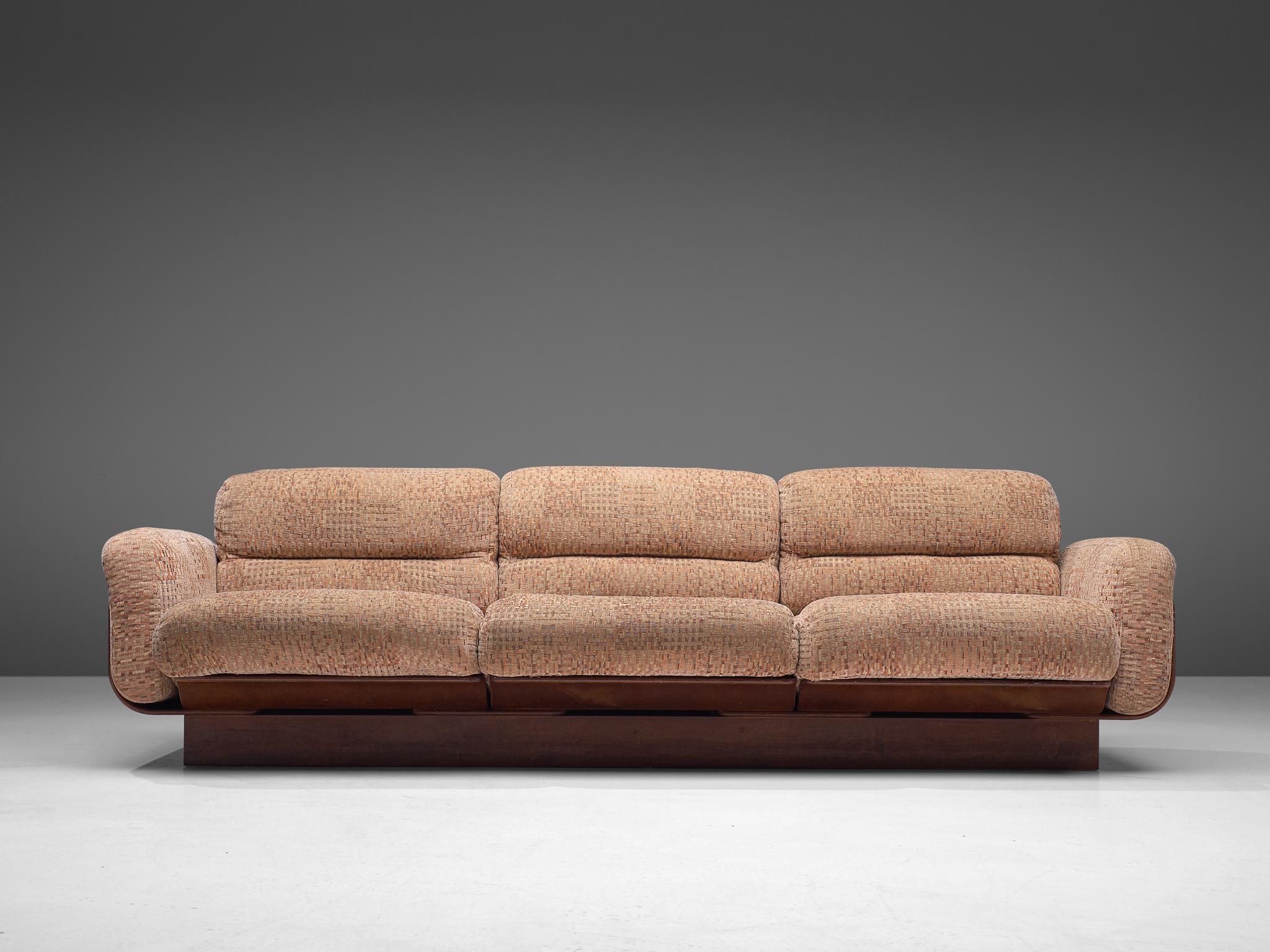 Asko, three-seat sofa, birch, fabric upholstery, Finland, 1960s

Bulky three-seat basket sofa in birch. Its frame functions as a shell that keeps the cushions in their position. The solid birch frame gives the appearance of a seat that flows. The