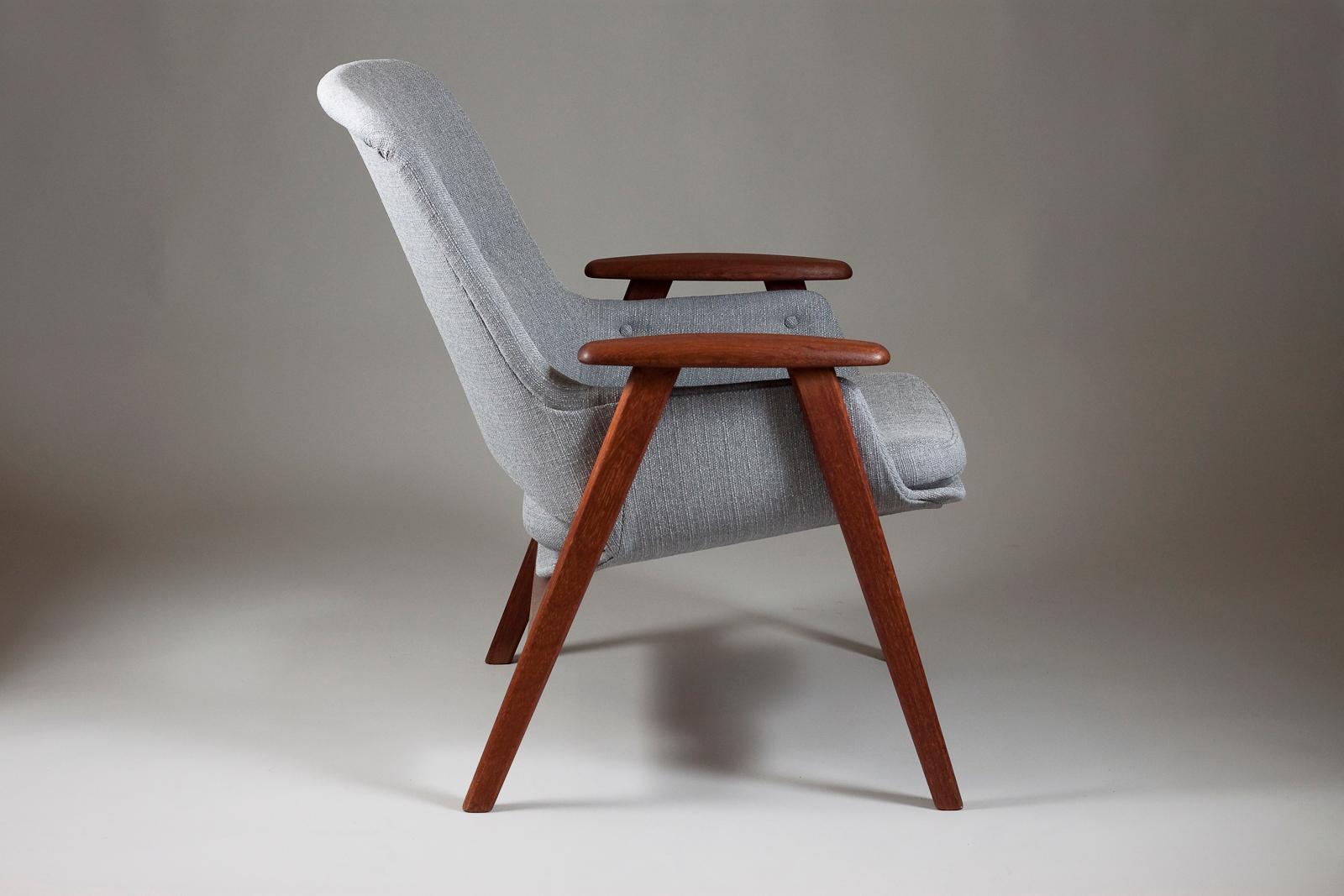 Beautiful Finnish Mid-Century Modern teak wood frame armchair in gray upholstery designed by Olof Ottelin for Stockmann Oy.