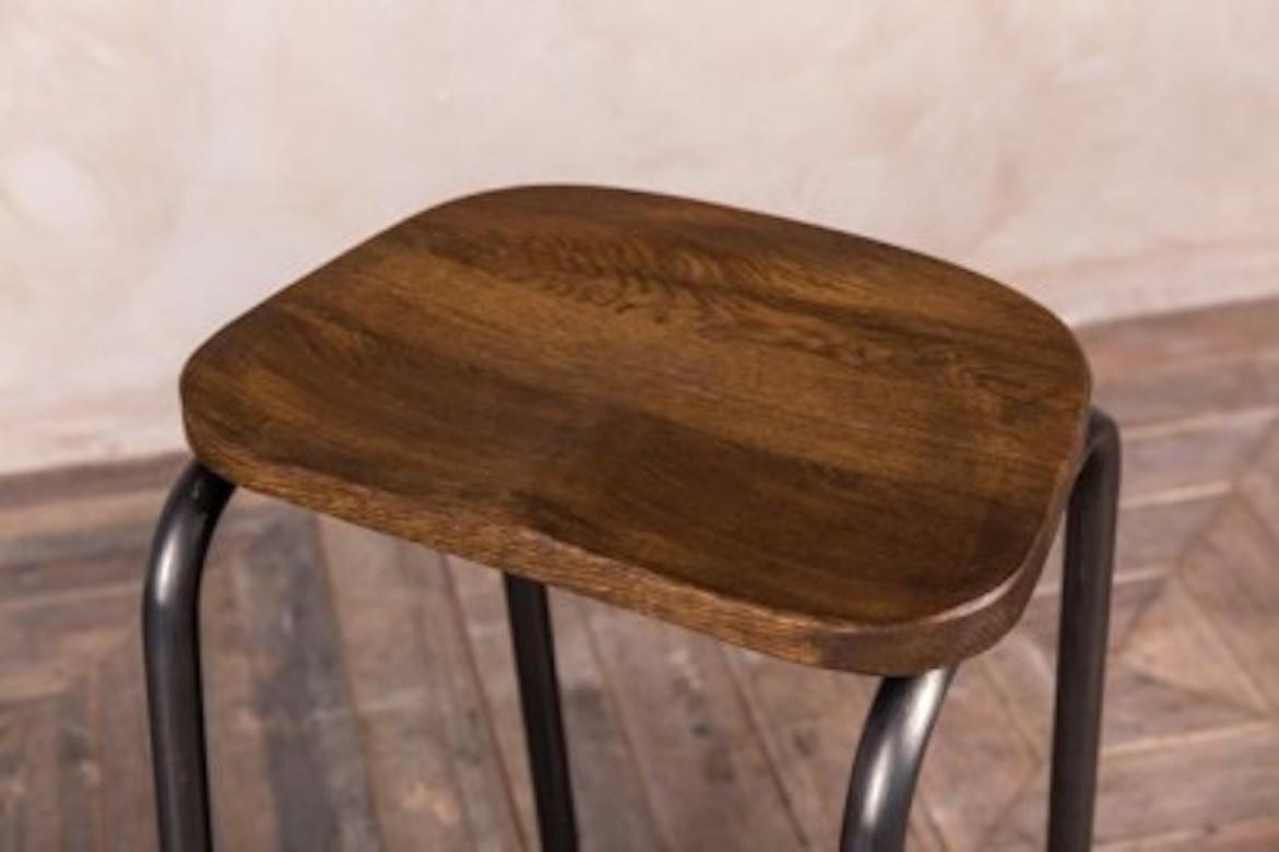 A fine Finsbury metal lab stool range, 20th century.

This metal lab stool is available in two heights and features a waxed, solid oak top.

These stools are a fantastic addition to our collection of vintage and industrial style bar and pub