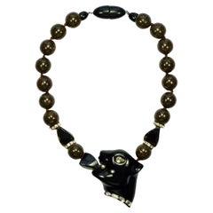 Fiocchi Italia Pantera negra y collar de cuentas de resina marrón