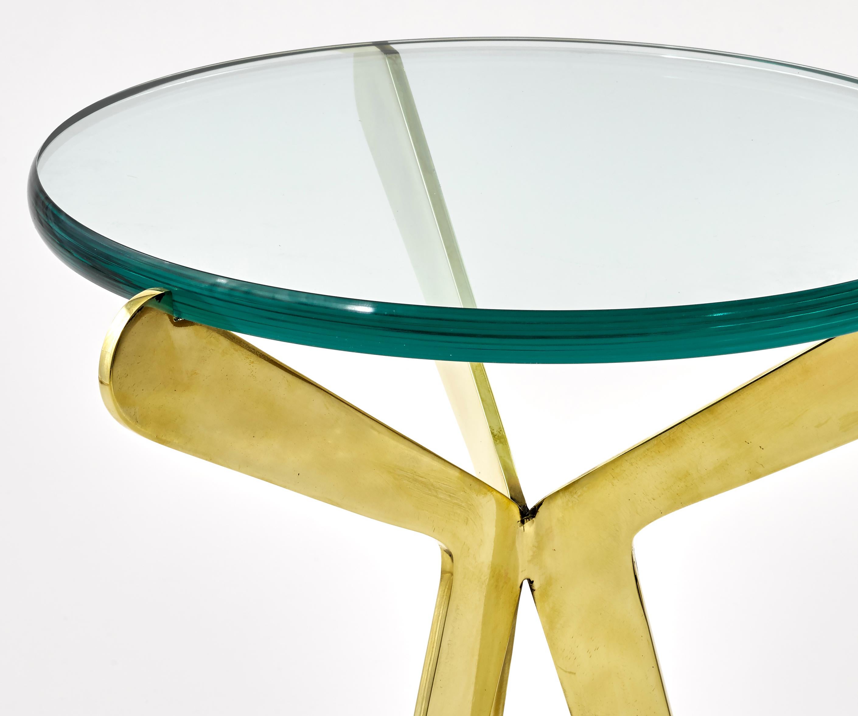 The Fiore table features three brass legs coming together at a central weld and then sprouting to hold a thick glass top. Shown in polished brass.

Customization Options:

Each piece is hand crafted in Italy and is available in any of our 10