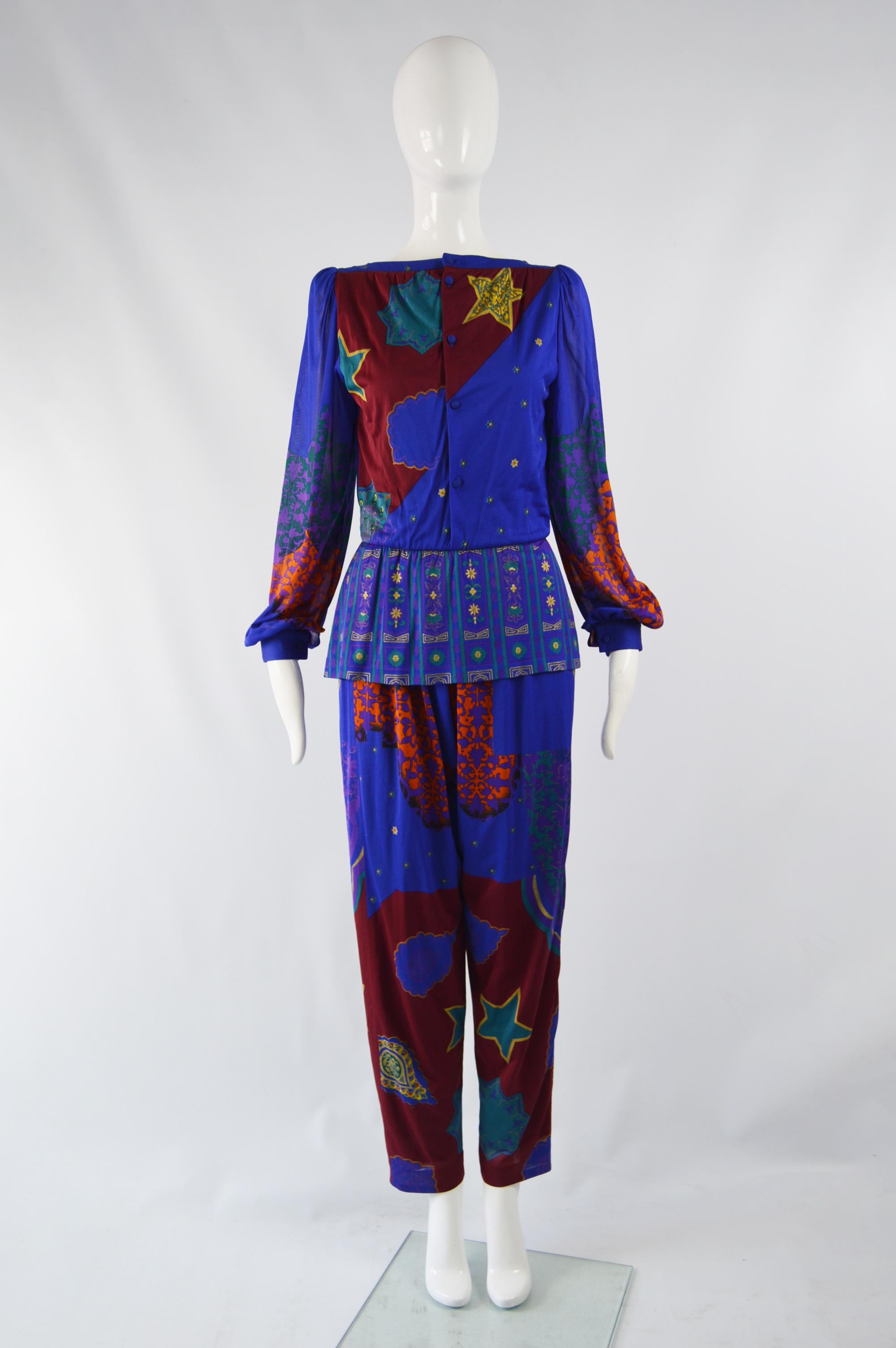 A fabulous harem style jumpsuit from the 80s by quality Italian label, Fiorella. In a blue patterned fabric with a boat neck, long bishop sleeves and a peplum that gives a Paul Poiret inspired look. 

Size: Unlabelled; fits roughly like a modern
