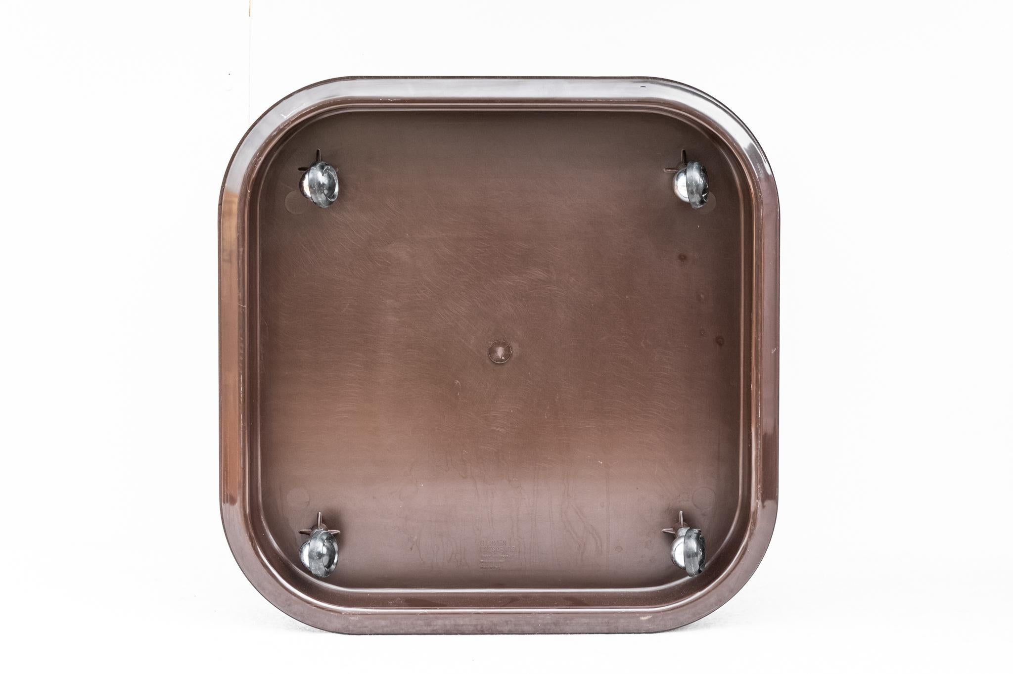 Planter/Pot Holder Crescendo by Isao Hosoe for Bilumen, Made in Italy, 1970s. 
Brown ABS planter/pot holder produced by Bilumen in the 1970s designed by Isao Hosoe. The square-shaped frame with rounded corners has four hemispherical wheels made of