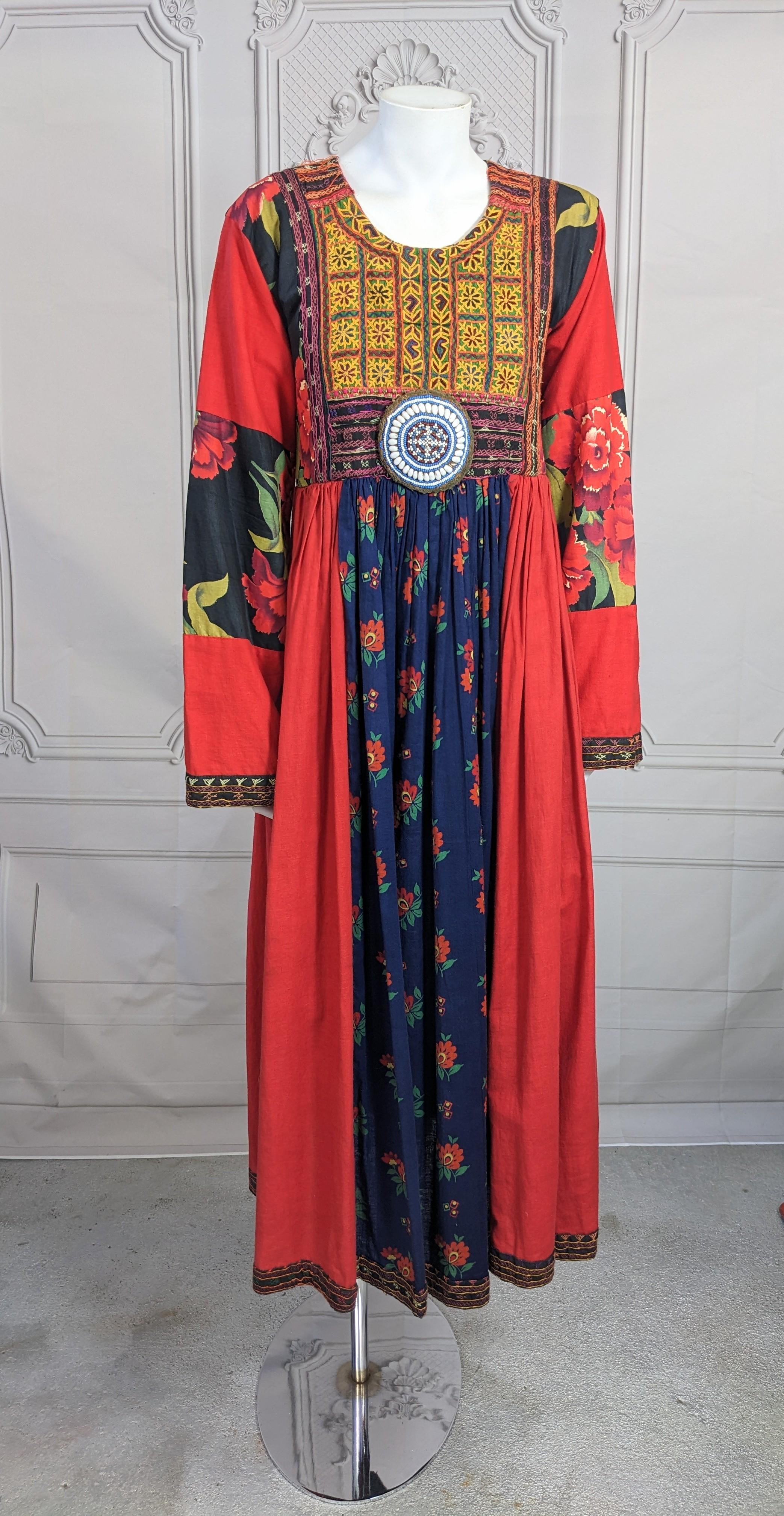 Fiorucci Bohemian Patchwork Maxi from the 1970's. Fiorucci offered massive variety in its lines before it became known worldwide in the Disco era. 
This Boho hippie style is a patchwork of fabrics and embroideries from different places. Red cotton