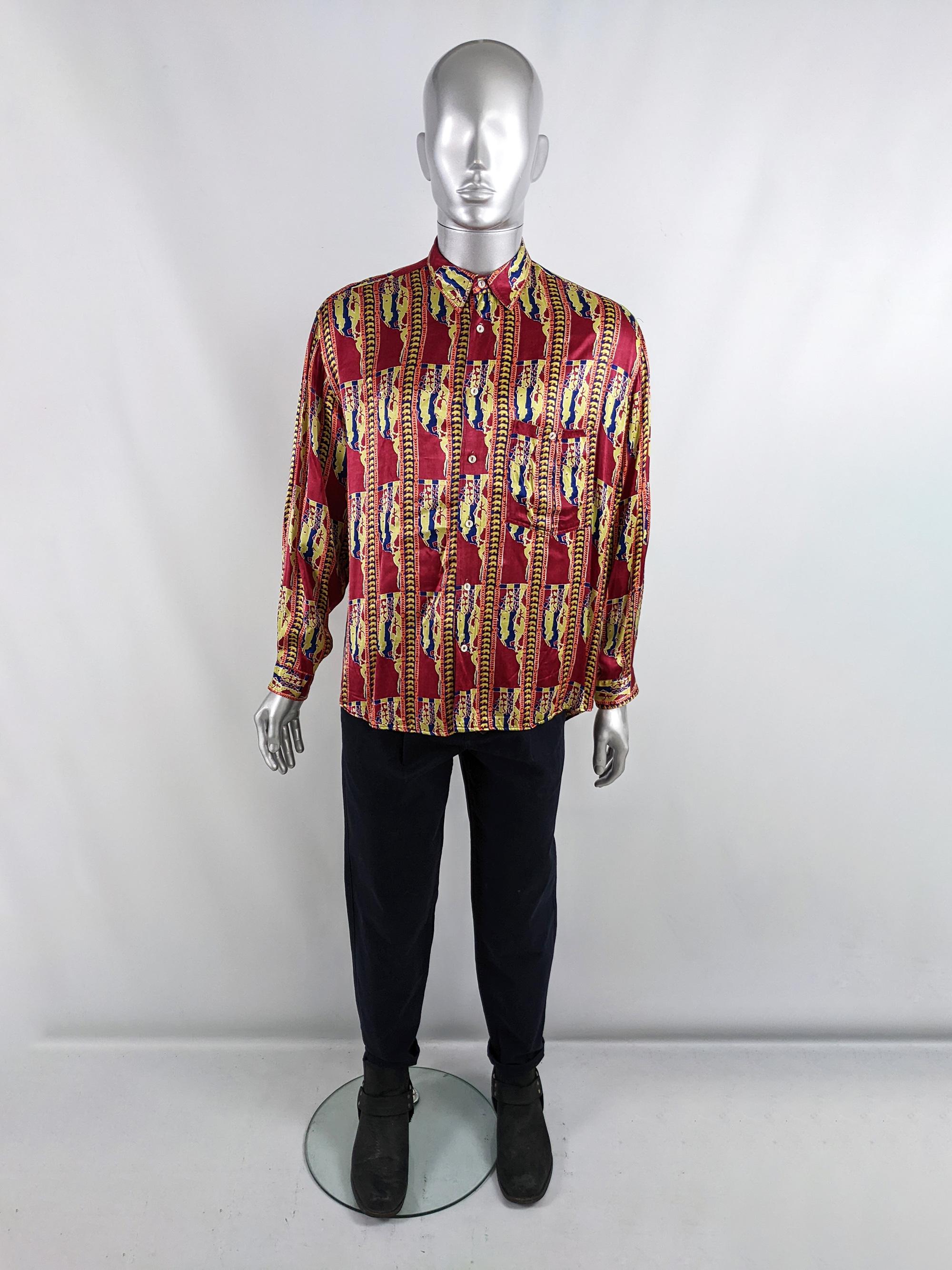 A rare and incredible vintage mens long sleeve party shirt from the 80s by luxury Italian label, Fiorucci. In a red and yellow satin fabric with an amazing bear and map pattern, it has 